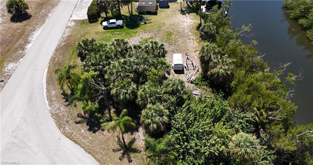 Direct Gulf-access lot in the St. Jude Harbors subdivision of Pine Island (part of, and just north of St. James City), property wraps around the end of the canal and has 50 of canal frontage on the opposite side of the canal. You effectively own the whole end of the canal with options to utilize it for expanded docks / decks, etc.  That in itself is already quite interesting from the ownership and user potential, but it gets better. Across from this property, this owner is also selling a 1.1 acre (freshwater) waterfront lot (3940 Stabile Road, St. James City), that encompasses the whole outside-corner and street length of this (inside-corner) lot. See aerials to grasp the magnificence of this rare combo opportunity!!!  If developed together, the gulf-access lot become your "fancy boat / guest house", while the huge freshwater lot would be a spectacular site for a waterfront mansion. What an amazing opportunity!  Now survey with topographic available too!