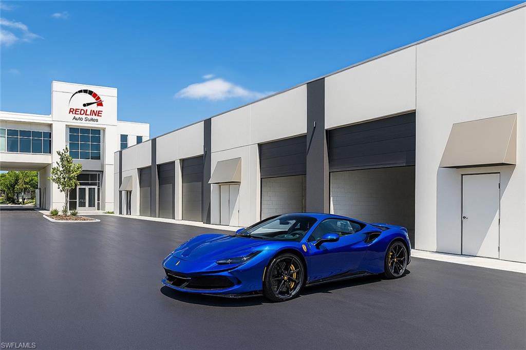 The Pinnacle of Automotive Luxury – Redline Auto Suites Units 1 & 2 - An unprecedented opportunity awaits the true connoisseur of automotive excellence. Units 1 and 2 at Redline Auto Suites are now offered for sale—with full architectural and interior design plans included to seamlessly combine both suites into a singular, state-of-the-art motor sanctuary. Envisioned with a floating mezzanine deck that spans both units, this is more than just storage—it’s a private gallery for your prized collection. Nestled within Naples' most elite motor condo community, Redline is a masterfully designed enclave of only 18 private auto suites, each crafted for those who live and breathe the car-culture lifestyle. This offering boasts approximately 2,000 square feet of open floor space, with the potential for 600 additional square feet of elevated loft space, perfect for a high-end lounge, office, or observation deck overlooking your personal fleet. The oversized 16’ wide x 14’ high roll-up garage doors welcome everything from supercars to custom transporters, while the interiors are delivered as a premium shell, ready to be transformed into your bespoke vision—whether that includes polished epoxy floors, glass-enclosed lounges, full bar and cigar humidor, or wall-to-wall automotive memorabilia. Each suite includes: (1) Pre-plumbed private restroom (2) Advanced HVAC with air-handler closet (3) Utility-ready water bib (4) 24/7 access and modern security infrastructure. Above the auto court, owners enjoy exclusive access to Redline’s Club Room—a dramatic, glass-wrapped lounge reminiscent of a speedway’s VIP grandstand suite. With panoramic views of the entire facility and curated social gatherings, the Club Room is a place where passion meets prestige. For the collector who demands more than just space—for those who seek experience, expression, and identity—this is your automotive sanctuary redefined.
