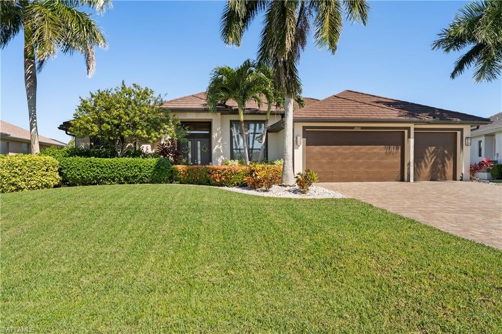 Experience the epitome of Florida living in this impeccably designed Gulf-access residence, offering 4 bedrooms plus a den, 3 full baths, and a 3-car garage. Built in 2016 with contemporary architecture, soaring ceilings, porcelain tile, and refined finishes create an modern, elegant yet inviting interior. Outdoors, a spectacular resort-style pool with spillover spa, sun shelf, and expansive paved lanai with a fully equipped summer kitchen set the stage for effortless entertaining, framed by panoramic picture-window screens. Boating enthusiasts will appreciate the 10,000-pound boat lift and Gulf access, while impact-rated windows and doors, a metal roof with a transferable 50 year warranty, a Kevla hurricane shutter on patio and numerous thoughtful upgrades provide added peace of mind. Complete with custom built-ins, a water softener, and a host of modern conveniences, this exceptional home seamlessly blends luxury, comfort, and the quintessential Southwest Florida waterfront lifestyle.