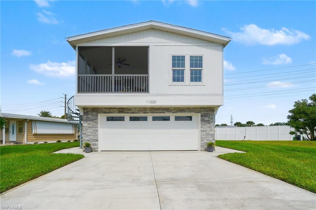 THIS ISN'T JUST A HOME—IT'S A LIFESTYLE! Quality construction, thoughtful design, and an incredible location come together in this beautifully maintained home in Bayside Estates. Situated just steps from the clubhouse and pool, this 2-bedroom home also offers an office/sunroom that provides flexible additional living space. With up to five parking spaces and a full garage beneath the home, there is room for vehicles, storage, and all the extras that come with enjoying Southwest Florida.

The quality of construction is one of the features that truly sets this home apart. Built on a substantial steel I-beam structure with a 12' steel frame, 2x10 floor joists, 2x6 walls, concrete pad, and helical supports beneath the steel beams, the home was designed with durability in mind. Hurricane windows, a hurricane-rated garage door, steel garage siding, composite decking and stairs, and a premium insulation package add to the home's thoughtful construction.

Inside, you'll find 9' ceilings, complete drywall, LVP flooring throughout, recessed lighting, and a chandelier over the dining area. The kitchen features an island and quality appliances, while the primary suite offers a double-sink vanity and large walk-in closet. The Allied commercial HVAC system features a variable-speed heat pump with 18.2 SEER2 efficiency. A screened lanai overlooks the community and creates the perfect spot to relax with a glass of wine at the end of the day or coffee at the beginning. Get this...paver area ready for a hot tub. 

And then there is Bayside Estates. This is a community where neighbors gather, activities are plentiful, and there is always something happening at the clubhouse. Residents have access to a community pool, pickleball, tennis, shuffleboard, horseshoes, bocce, fitness facilities, library, community room, cards, gatherings, and a busy social calendar.  All of this with a very low HOAfee!

Best of all, the location puts you just 2.5 miles from the sugar-sand beaches of Fort Myers Beach. Ride your bike to the island, take the trolley, or make the quick drive to the beach, restaurants, entertainment, and waterfront destinations. The Sanibel Causeway is also just minutes away, opening the door to spectacular sunsets, shelling, boating, and exploring everything Southwest Florida has to offer.

Whether you're looking for a full-time residence, seasonal retreat, or a place to enjoy between adventures, this home delivers a rare combination of quality construction, community, and proximity to the beach. Transferable flood insurance policy may be available; buyer to verify terms and transferability with the insurance provider. 55+ community.