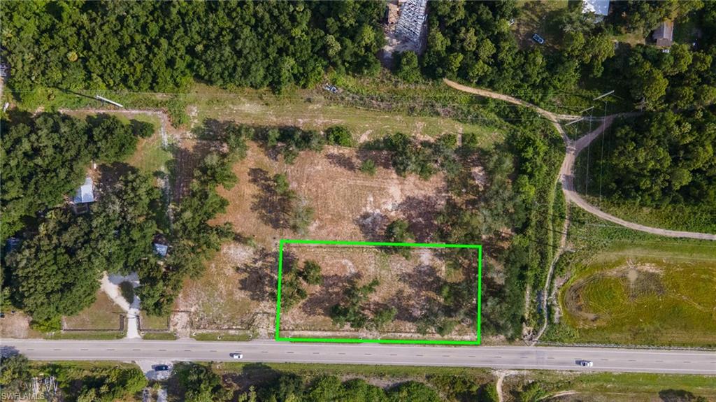 Rare opportunity to own agricultural land in the heart of North Fort Myers. This clean, 1.02-acre AG-2 zoned parcel (Rainbow Estates Unrec Blk C, Lot 14) offers exceptional versatility — eligible for agricultural use, single-family residential, manufactured home, or mobile home placement. The lot presents beautifully for its size, with a well-maintained, open feel ready for your vision. Please note this parcel carries a 60-foot road and utility easement; buyers to verify during due diligence. Direct road frontage on Mellow Dr provides easy access and solid positioning for development or personal use. Bonus opportunity: This parcel is one of three adjacent lots available on Mellow Dr. Combine with 6050 & 6080 Mellow Dr (listed separately) to assemble a +/- 3.37-acre package, ideal for investors, developers, or buyers seeking a larger footprint in a growing North Fort Myers corridor. Each lot is available individually or as part of the full package. Parcel ID: 18-43-25-01-0000C.0140.