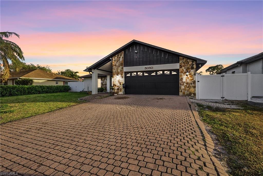 Beautiful remodeled POOL home on a CANAL in Golden Gate City. Garage converted into an ANEXO permitted - perfect for guests or income potential. BRAND NEW AC, NO HOA and NO flood insurance required. Fall in love with the breathtaking views this property offers, featuring a screened-in lanai, modern white ceramic tile throughout, quartz countertops with a waterfall island, new appliances, and upgraded bathrooms.
Fully fenced and move-in ready. Come see it by yourself