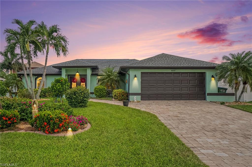 LOCATION, LOCATION, LOCATION! Beautifully upgraded Cape Coral pool home situated across from million-dollar gulf-access homes and within walking distance to popular restaurants, shopping, and everyday conveniences. This home is packed with valuable upgrades, beginning with a whole-house propane generator—a major Florida advantage offering added comfort and peace of mind. Additional improvements include a 2023 roof, accordion hurricane shutters, epoxy-coated garage flooring, upgraded kitchen, upgraded wood-look vinyl flooring, and a whole-house water filtration system. The owners also added a beautiful heated pool featuring pool-floor heat returns for efficient heating and also a relaxing water feature, along with 6-foot vinyl privacy fencing. Lush, mature tropical landscaping creates a private backyard retreat and is truly a gardener’s dream. Enjoy the Southwest Florida lifestyle with dining, shopping, boating, fishing, and Gulf Coast amenities nearby. With major improvements already completed and exceptional outdoor living, with rear Western exposure, the sunsets never get old. This move-in-ready home offers outstanding value. Schedule your private showing today, before it's gone!