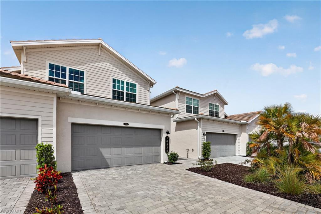 MOVE-IN READY!! Step inside this expansive 2,110-square-foot attached home, the largest in the Willowgreen at Babcock Ranch collection. The first floor is anchored by an impressive two-car garage with hurricane-rated door and keyless entry for added security. Upstairs, bright and open living spaces are designed for effortless entertaining, with a sleek kitchen that features quartz countertops, a spacious island and a full suite of brand-new stainless steel appliances—including a gas range, built-in microwave and French door refrigerator. Sliding doors lead to your private, screened patio retreat, perfect for gatherings or quiet nights outdoors. All three bedrooms, including the luxurious owner’s suite with a spa-inspired bath, are thoughtfully placed on this level, offering oversized walk-in closets and modern finishes throughout. Every detail, from ceramic tile flooring and LED recessed lighting to a Ring Video Doorbell Pro and a Honeywell Home T6 Pro Wifi smart thermostat, is crafted for comfort and convenience. Designer cabinetry, EPA WaterSense® fixtures and hurricane-impact windows add both style and peace of mind. Homes like this—with premium features, energy efficiency and a prime location moments from Founder’s Square—won’t last long.

Prices, dimensions and features may vary and are subject to change. Photos are for illustrative purposes only.