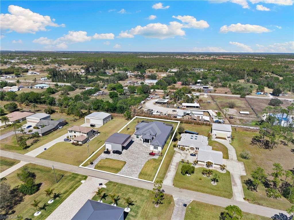 Modern large home on 1 acre, yes 20' entrance ,almost 10,000 sqf with over 6000 sqf living area  with your detached air conditioned  foam insulated 40x50 hangar for your aircaft and other toys.