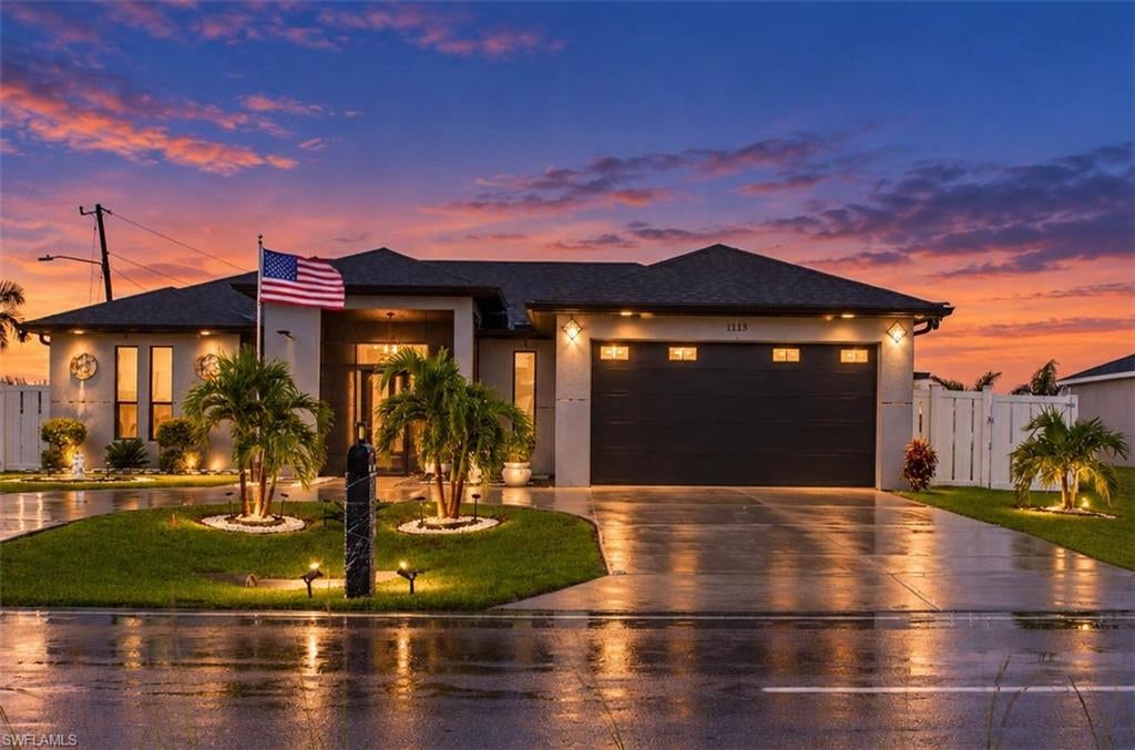 Welcome to your dream modern single-family home in premier Cape Coral! This immaculate 3-bedroom, 2-bathroom, 2-car garage residence combines luxury and everyday practicality on a desirable, private corner lot with an eye-catching circular driveway. A seamless flow connecting the main living areas, enhanced by continuous, elegant tile flooring and abundant natural light. Features sleek quartz countertops, premium stainless steel appliances, crisp white 42" cabinetry, and an upgraded Culligan water treatment system. Fully equipped with impact-rated windows and doors that offer complete storm protection while brightening every room. Step out onto the covered tile lanai to enjoy the year-round Southwest Florida sunshine. A massive, private oversized backyard provides endless possibilities to design and build your custom dream pool. Situated in a peaceful neighborhood close to local shopping, dining, and scenic parks. Schedule your private showing today—this incredible home won't last long, and the seller is Hiighly Motivated!!!
