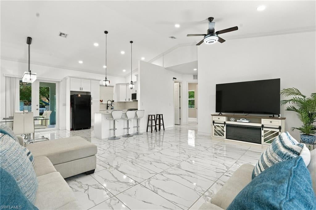 THE BEST PRICED NEW CONSTRUCTION PROPERTY ON 1.25 ACRES IN SOUTH FLORIDA! Custom-built and thoughtfully designed, this FULLY furnished home delivers the space, privacy, and upgrades buyers are searching for—all on a much desired CORNER lot in Montura Ranch Estates. The entire 1.25 acres is fully fenced and features two separate driveway entrances, offering added convenience and flexibility. Designed with durability in mind, the home features a metal roof and hurricane-impact windows and doors for added protection and peace of mind. The Gazebo creates the perfect setting for outdoor gatherings, weekend barbecues, and relaxing, enjoying your own private piece of Florida. Sprinkler system installed! The carport and storage shed add even more convenience to the property. Inside, the attention to detail continues. Beautiful tile flooring throughout the home, complemented by custom-tiled showers, custom mirrors, and modern finishes. And there’s no waiting to furnish it—the home is being offered fully furnished and move-in ready. This isn’t your average new construction home—it’s a complete property offering the freedom of acreage, the benefits of new construction, and the finishing touches already in place. Enjoy the freedom of NO HOA fees/restrictions and the flexibility to bring your animals too! Opportunities offering this much at this price are hard to find. Schedule your private showing and experience it for yourself today.