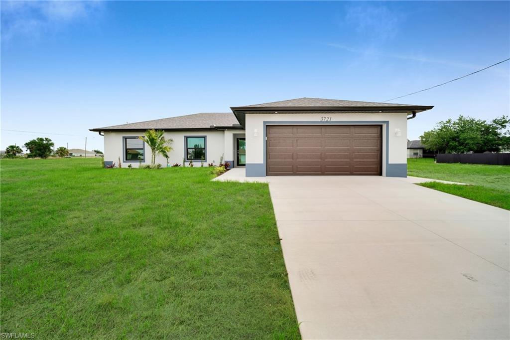 Brand new construction with a layout that actually makes sense. This 4-bedroom, 3-bathroom home delivers 1,897 sq ft of living space finished with high-end materials throughout, sitting on a generous lot with room to add a pool and plenty of yard to spare. FULLY EQUIPPED MOTHER IN LAW, WITH FULL BATH, ROOM, KITCHEN, LIVING SPACE AND LAUDRY. The kitchen is the centerpiece of the main living area, featuring an oversized quartz island, white shaker cabinets, stainless steel appliances, and large-format porcelain tile floors that run continuously through the entire home. Crystal pendant lighting over the island and recessed cans throughout keep the space bright and modern without feeling overdone. The primary suite is spacious and leads directly into a spa-style bathroom with dual sinks, quartz counters, designer wall tile, and a frameless glass walk-in shower with hexagon floor tile. Clean, well-executed finishes top to bottom. What sets this one apart is the private in-suite bedroom with its own full bath and kitchenette, complete with cabinets, sink, microwave, and refrigerator. It works perfectly as a guest suite, in-law quarters, or rental opportunity within the home. Additional highlights include a den/flex room, open lanai, automatic sprinkler system, stacked washer/dryer, auto garage door, walk-in closets, and built-in cabinetry throughout. Everything is new, everything is clean, and the lot gives you room to grow. Move-in ready. No HOA. No CDD. No waiting on a builder.