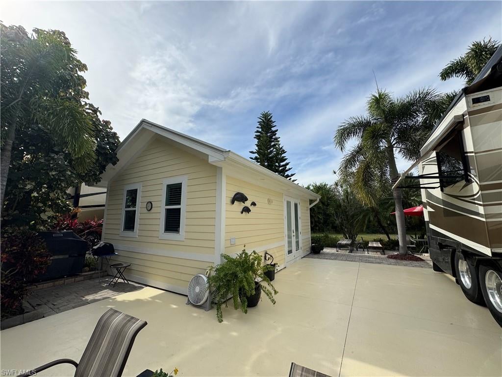 Some properties simply feel right the moment you arrive, and Lot 45 is one of them. Owner financing is available, and two golf carts are available too! Perfectly positioned within RiverBend Motorcoach Resort, this inviting back-in lot offers the perfect blend of privacy, comfort, and thoughtful conveniences. A spacious backyard creates your own private retreat, ideal for entertaining friends, enjoying peaceful mornings with coffee, or giving your four-legged companions room to stretch their legs. Across the street, you'll appreciate the added convenience of extra parking, while the quiet setting offers a welcome escape without sacrificing easy access to the resort's exceptional amenities. The impressive 16' x 24' coach house welcomes you with two sets of French-style doors that fill the space with natural light. Inside, you'll find a well-appointed kitchenette, a spacious bathroom with glass shower doors, a washer and dryer, generous closet space, elegant crown molding, uplighting, and lofted storage that maximizes every square foot. Step outside to your own private outdoor living space, perfect for relaxing or entertaining. Just a short stroll away, a charming pedestrian bridge overlooks a peaceful lake with twin illuminated fountains, creating a beautiful backdrop both day and night. Even better, this property is offered nearly turnkey. Furniture, the BBQ grill, two golf carts, and several additional conveyable items are included, allowing you to begin enjoying the RiverBend lifestyle from day one. Be sure to ask for the complete list of included items. Life at RiverBend is designed to be enjoyed year-round. The heated resort-style pool and two hot tubs are always waiting, while the resort comes alive at the beginning of the season with an exciting calendar of social events, entertainment, and activities. Spend your days playing pickleball, bocce, shuffleboard, billiards, or perfecting your putting game. Relax at the cabana bar, explore three welcoming clubhouses, or simply unwind beneath majestic oaks overlooking the Caloosahatchee River. When evening arrives, gather with friends for Tap Room Trivia, Texas Hold'em, bourbon and cigar nights, live entertainment, dancing, bingo, bunco, and countless seasonal events that make RiverBend such a special place to call home. If a quieter pace is more your style, stroll scenic walking paths, cross charming footbridges, watch herons, ibis, and turtles, or launch your boat for an unforgettable day on the river. Whether you're seeking an active social lifestyle or peaceful days surrounded by nature, RiverBend Motorcoach Resort offers the perfect balance. This isn't simply a place to park your Class A motorcoach, it's where lasting friendships, unforgettable experiences, and your next adventure begin. Please ask for the complete list of conveyable items and schedule your private tour today.
