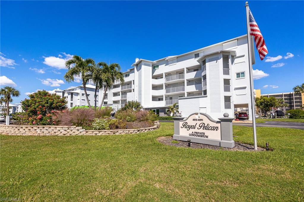 BOAT SLIP #9 AND UNDER-BUILDING PARKING! Experience the best of coastal luxury and island living in this beautifully appointed two-story townhouse located in the highly sought-after Royal Pelican community on Fort Myers Beach. Sold turnkey furnished, this residence is perfect for boaters, beach lovers, and seasonal residents seeking an effortless Florida lifestyle. The light-filled interior features diagonal tile flooring, a stylish kitchen with granite countertops, mosaic backsplash, and sliders opening to a screened lanai overlooking peaceful canal waters. Upstairs, two spacious en-suite bedrooms offer laminate wood floors, with one featuring its own private screened lanai, ideal for relaxing and enjoying the evening breeze. Recent updates include a new A/C (2024), new washer & dryer (2025), and water heater (2017) for added comfort and peace of mind. Boating enthusiasts will appreciate quick 10-minute Gulf access and the ability to explore waterfront dining and entertainment right from your dock. The Royal Pelican community offers two heated pools, a clubhouse, shuffleboard, a fishing pier, tennis and pickleball courts, and deeded beach access, creating the ultimate island retreat. Conveniently located on the quiet south end of Fort Myers Beach, just a short walk to shopping, dining, and the island’s white sandy shores. Live where boating, beach days, and breezy sophistication come together to create the ultimate Fort Myers Beach lifestyle.