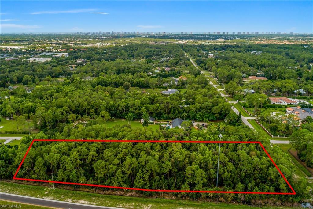 Rare 2.86-acre homesite in Livingston Woods, one of the last true acreage enclaves in central Naples. No HOA and no design committee, so you build your custom residence on your own timeline, with room for a guest house, pool, workshop, or oversized garage, subject to Collier County codes. A May 2025 informal upland-wetland determination by a licensed environmental consultant classified the assessed parcel as upland, with no state or federal wetland permit and no compensatory mitigation anticipated. A current boundary survey is on file, so a buyer can move to design and permitting without starting from zero. The wooded parcel sits east of Airport-Pulling Road and west of I-75, north of Pine Ridge Road, minutes to Waterside Shops and Mercato and roughly fifteen to the Gulf beaches. Environmental findings are informal and subject to agency verification. Buyer should independently verify zoning, setbacks, access, utilities and flood information.