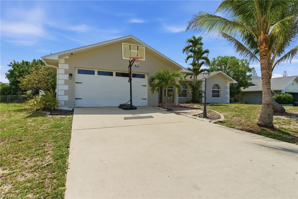 Price Improvement and a motivated seller is a win- win!  This 3-bedroom, 2-bath home with exceptional attention to detail — including crown molding throughout, modern light fixtures, and a contemporary color scheme — is sure to get you excited to live and entertain here. The home also features a new roof installed in 2023, new A/C in 2025, new hot Water tank in 2024, and new pool filter in 2024. All this provides a peace of mind for years to come, along with the potential for insurance savings. The kitchen features granite countertops, under-cabinet lighting, stainless steel appliances, and a unique wood tray ceiling, adding yet another touch of designer detail. Overlooking the well-lit dining area, spacious great room, and screened lanai, this layout is ideal for entertaining family and friends.
The oversized owner’s suite offers plenty of room for a sitting area, while sliding glass doors open directly to the screened lanai and pool area. Relax under the shade of the wood ceiling lanai, which beautifully complements the wood-look flooring found throughout the 3 bedrooms and owner’s bath.  Located in SW Cape Coral, you are just minutes from parks, restaurants, local shops, grocery stores, the Cape Coral Yacht Club, Cape Harbour, Tarpon Point, and the Cape Coral Parkway Bridge leading into Fort Myers. Evening walks or bike rides are the perfect way to enjoy this wonderful neighborhood and everything SW Cape Coral has to offer.