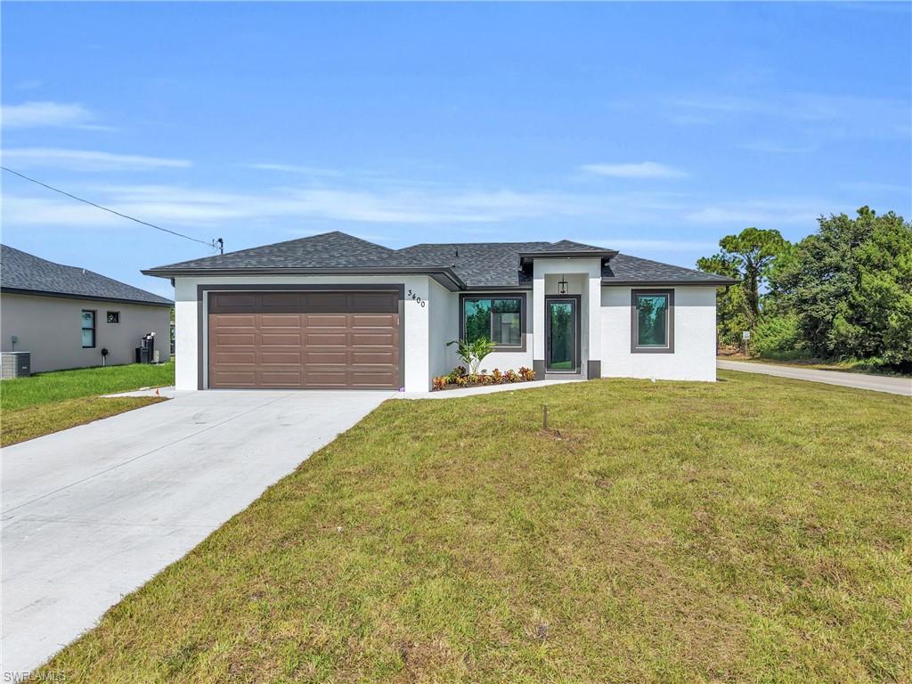 Beautiful New Construction Home in the best area in Lehigh Acres!!! Three bed, two bath, two car garage, the spacious quartz countertops with stunning waterfall edges on both ends, creating a sophisticated, modern look while providing ample space for meal preparation and entertainment. Impact doors and windows with Energy System Low-E, keeping your home comfortable year-round while saving energy costs. Stainless-steel appliances, imported porcelain tile throughout, sprinkler system, easy access to Fort Myers, I-75, 10 minutes to RSW International Airport, close to schoools, shops, restaurants etc... Come to chech this out and make your offer today!!!