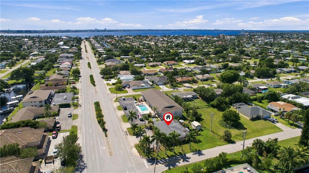 Fully updated duplex offering 4 bedrooms, 2 bathrooms, and 2,056 square feet of living space. Each unit features its own private laundry, fenced yard area, dedicated parking, and storage space, providing excellent privacy and convenience for both owners and tenants. Ample room for boat parking adds to the property's appeal for waterfront lifestyle enthusiasts. Ideally located within walking or biking distance to the exciting $55 million yacht club renovation, featuring a public beach, fishing pier, boat ramp, boat storage, waterfront dining, pickleball courts, and park amenities. Also just minutes from the highly anticipated Bimini Basin redevelopment, vibrant nightlife, and world-class dining options. Unit A is owner-occupied, while Unit B is currently leased and offered fully furnished, creating an excellent opportunity for investors, owner-occupants, or those seeking rental income in a rapidly growing area. A rare chance to own an updated income-producing property in one of Cape Coral's most desirable locations.