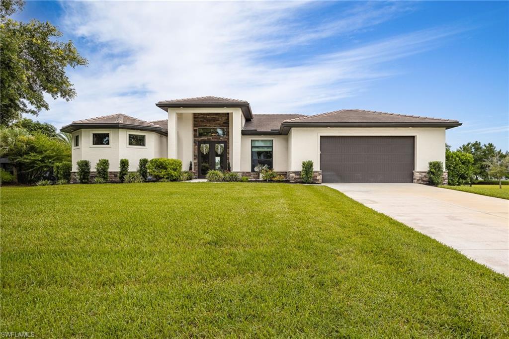 SPACIOUS POND VIEW HOME ON OVERSIZED LOT IN BEAUTIFUL ALVA, FL! Experience Florida living at its finest in this spacious 3-bedroom plus den, 2-bath, 2-car garage 2023 home in the stunning Riverwind Cove community in Alva, Florida.

The curb appeal on this home welcomes you from the outside in, with stone detail lining the base of the exterior and the front entryway, and a large front porch including a sitting area to greet guests or simply enjoy the beautiful Florida sunrises and sunsets.

Tall front doors with large glass panels lead into an inviting foyer featuring a modern chandelier, and allow plenty of natural light to flow into the open living space. Two sets of french doors contribute more natural light to the living and dining areas, while vinyl flooring throughout the home allows for easy maintenance.

Located adjacent to the living area, the kitchen features a breakfast bar and plenty of granite countertop and storage space, ideal for meal prepping and entertaining guests without skipping a beat. The formal dining room is on the other side of the kitchen, allowing you to transfer meals from the stove to the dining table with ease.

Retreat to the primary bedroom, with its own set of french doors, a large walk-in closet, and an en suite bath with double sinks, roll-in shower with dual shower heads, and built-in vanity desk. Two other bedrooms and a second bath provide plenty of space for family and guests, plus a den for additional guest space, an office, or recreational space. 

Enjoy the views of the pond right in your backyard from the covered patio, while your children and pets may safely roam free in the large fenced-in backyard. For added peace of mind, this home is equipped with full impact-resistant windows throughout and is generator prepped with a convenient exterior generator hookup. The home also features a partial-home Reverse Osmosis filtered water system, epoxy flooring in the garage, and is located on an oversized lot with plenty of room for a detached garage or a pool. Not to mention, NO FLOOD INSURANCE IS REQUIRED!

Nature enthusiasts will truly appreciate living in the Riverwind Cove community, as it boasts plenty of wildlife, large oak trees, and rural Florida views while still being ideally located close to plenty of dining, shopping and entertainment options, including Boathouse Tiki Bar & Grill. Riverwind Ranch also has horse stalls currently available!

Don't miss out on this one-of-a-kind opportunity to live the Florida dream and schedule your private tour today!