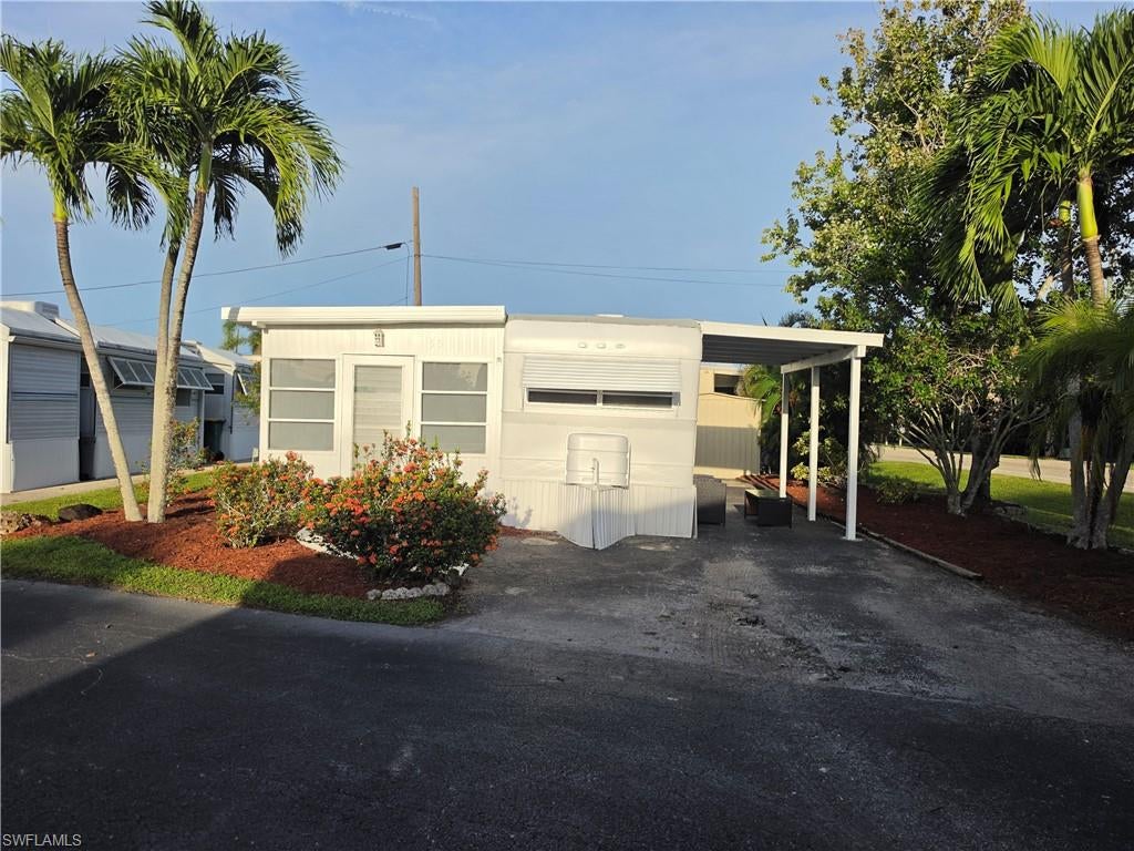 Enjoy affordable Naples living with GULF ACCESS! This charming, furnished home is located in Holiday Manor, an active 55+ community, perfect as a seasonal getaway or full-time Florida residence. Featuring tile flooring throughout, this home offers easy maintenance and comfortable Florida living.

Enjoy LOW monthly fees with no separate lot rent! Holiday Manor offers great amenities including a heated pool, hot tub, clubhouse, shuffleboard, private boat launch, boat storage, and Gulf access. Ideally located between Naples’ 5th Avenue and Marco Island, with convenient access to beaches, shopping, dining, and I-75.

An affordable opportunity to own your piece of paradise in Southwest Florida!