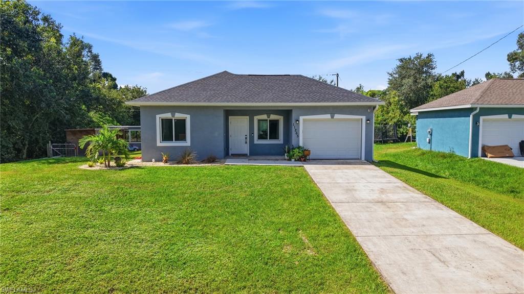 Built in 2023, this 2-bedroom, 2-bath home with a den offers 1,104 square feet of heated living space on an approximately 8,000-square-foot lot
in South Punta Gorda Heights. The single-story layout includes a living room, kitchen, two bedrooms, and a den offering flexibility for a home
office, hobby area, or additional living space. The primary bedroom features two standard closets, while the second bedroom includes a standard
closet. Interior features include central heating and air conditioning, ceiling fans, and laminate flooring. Outside, the fenced yard includes a
chicken coop and covered storage, providing additional space for outdoor use and storage. Block and stucco construction, a shingle roof, and an
attached one-car garage complete the property. With no HOA fees, this home offers practical indoor and outdoor features with room to make the
space your own