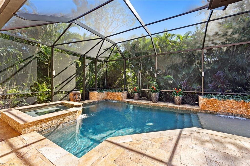 Welcome to a home that instantly makes you exhale — a place where light, space, and nature come together to create a truly effortless Florida lifestyle. Tucked within the highly sought-after community of Pelican Landing, this 3-bedroom + den, 3-bath home offers an inviting blend of comfort, character, and the kind of privacy that feels like a luxury all on its own. The moment you step inside, you’re greeted by sun-filled spaces that draw you in and guide you from room to room. The great-room layout feels open yet intimate, with soaring ceilings and walls of windows that frame the lush greenery outside. The kitchen stands at the heart of it all — a warm, welcoming space with a center island, generous storage, and both formal and casual dining options that make everyday living feel easy and gathering with friends feel natural. The master suite is its own peaceful hideaway, tucked thoughtfully for quiet and relaxation. With direct lanai access and a spa-style bath featuring a jetted tub and separate shower, it’s the perfect way to begin and end each day. Two additional guest rooms and a private den give you the flexibility to create the spaces you need — a home office, a media room, a reading retreat, or simply a comfortable haven for guests. But nothing compares to the home’s private outdoor oasis — a true extension of your living space and the crown jewel of this property. Step outside to a sprawling screened lanai surrounded by rich, mature landscaping that creates complete privacy. Here, mornings are peaceful with coffee by the pool, afternoons drift into hours of sun-soaked relaxation, and evenings are best spent unwinding in the spa as the sky turns shades of coral and gold. It’s not just a backyard — it’s a sanctuary. Beyond your front door, Pelican Landing offers an unmatched lifestyle with amenities rarely found anywhere else: a private beach park accessible by boat shuttle, sailing, canoe and kayak facilities, tennis, pickleball, a state-of-the-art fitness center, a butterfly garden, miles of walking paths, and a vibrant calendar of community activities. It’s a place where every day feels like a getaway. This home captures the very best of Southwest Florida living — beauty, privacy, and the sense of ease that comes from being exactly where you’re meant to be. If you’re looking for a retreat that feels both elevated and warmly livable, welcome home.