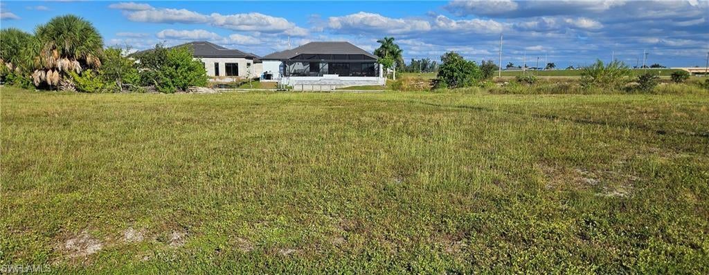 Cleared and seawall in, with only one bridge to open water, and its a 10 footer! This lot is located smack in the middle of everything new and upcoming in Cape Coral. Gulf access lots are going fast, and there are only so many left. Interest rates are going down, which we all know drives prices up, especially on limited inventory lots like Gulf access. No Owls or turtles on this lot (I walked it myself just before listing) and the seawall is beautiful! NW Cape Coral’s “Catch the Vision” surge is set to drive 12–20% property value growth here by 2027 (per Norada, Oct 2025 and Realtor.com Q4 forecasts), fueled by massive nearby projects drawing residents, jobs, and tourism. Crystal Lake Regional Park (0.3 miles north) opened July 18, 2025, delivering instant lifestyle perks with its 45-acre lake, beach, trails, and scuba zone. Hudson Creek (4 miles north), a 1,745-acre powerhouse with 4,000+ homes and retail, kicked off construction in March 2025. Seven Islands Marina Village (2.2 miles west) broke ground early this year on 48 waterfront acres of hotel, shops, and slips, boosting boating appeal. Paraiso North Cape (2.8 miles NW) opened late 2025 with retail and dining plazas, while Cape Coral Grove (5.2 miles SW) launched construction late last year as a 131-acre live-work-play hub. Cape Coral's 19-acre NW CRA acquisitions (Aug 2024) seal the deal for sustained mixed-use momentum.