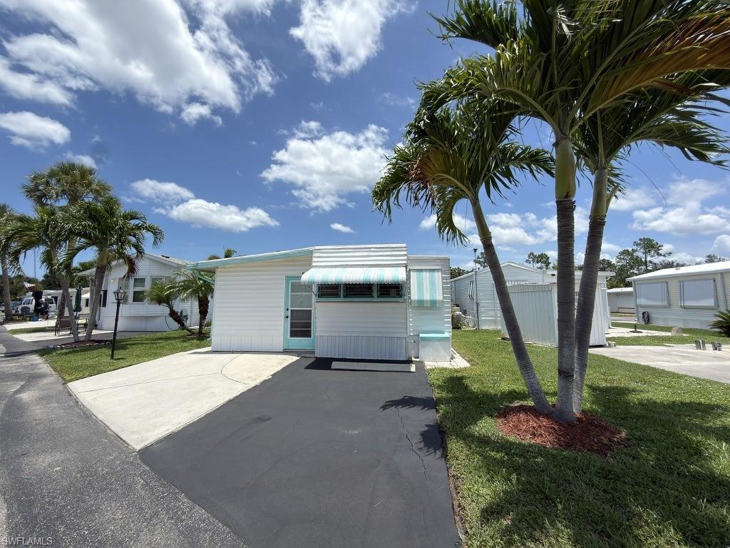 Welcome to Enchanting Shores, a Resident-Owned Co-op where residents own the Land with ZERO LAND LEASE. This 2-bedroom, 2-bathroom property gives you the opportunity to get in at the lowest price point of any manufactured home currently available in the 34114 zip code. This property offers immense flexibility. Move right in and customize the existing home to match your style, or utilize this premium resident-owned site to place a brand-new manufactured home or RV.. The home is a blank canvas perfectly suited for an efficient, modern ductless mini-split system, avoiding the moisture and flood risks associated with traditional under-apron central air ductwork in Southwest Florida. This active community offers low-cost living with minimal monthly dues and a wide range of amenities, including a boat launch, community pool, tennis courts, bocce ball, pickleball courts and more! Whether you enjoy socializing or staying active, there's something for everyone. Indirect Gulf access via the canal means you're a boat ride away from Keewaydin Island on any given afternoon. For a nominal fee of just $180 per year, you can store your boat right on-site, making it easy & inexpensive to take advantage of the area’s incredible waterways. Tucked between Naples and Marco Island, you're close enough to Fifth Avenue for dinner or a night out, and within easy reach of some of the best beaches in Southwest Florida. Whether you're looking to renovate or build a new mobile home or RV, this property offers flexibility and great value in a prime location, making it a smart investment in Southwest Florida's thriving boating community. Stop renting & start owning!