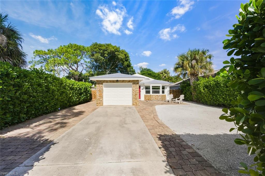 This beautifully updated Naples Park, 3 bedroom, 2 bath home with a 1 car garage, lends itself nicely for use as a vacation retreat, full time residence, and/or investment opportunity. Hurricane rated windows, doors, sliders and garage door were installed for peace of mind. The lot is situated in Flood Zone X, requiring no flood insurance. Newer renovations of kitchen and bathrooms, plank look vinyl floors throughout, AC and ductwork (2018), and a metal roof are all a plus. There are NO HOA fees, and no pet or rental restrictions. There's room for a pool in the spacious fenced backyard. LOCATION! LOCATION! 30 minutes from RSW (Ft. Myers Int'l Airport), 5 minutes to Vanderbilt Beach and Delnor-Wiggins Pass State Park, a short drive to Mercato shopping, dining, and entertainment, NCH (North Hospital branch close by), The Pavilion Shopping Center (with LA Fitness, bicycle shop, movie theater, jewelry store, ice cream shop, and numerous restaurants), public tennis and new pickleball courts on Vanderbilt Beach Road make this a convenient place to live the paradise life.