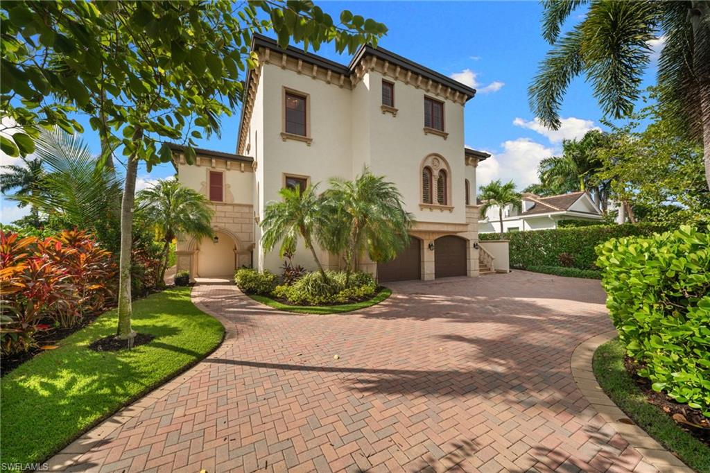 Rarely available three-story waterfront residence in Golden Shores offering exceptional scale, quality construction, and outstanding value in today’s market. With 5,139 SF of AC living area, an additional 1,659 SF of lower-level flex space, a 772 SF garage, more than 9,000 SF under roof, and over 10,000 SF of total usable space including the courtyard, this is a truly substantial property that would be extremely difficult to replicate today.
Built with concrete construction on all three levels, the home sits high above flood elevation, with the main living level at approximately 15’6”, well above FEMA’s 10’ flood elevation. Features include impact windows and doors, newer roof, elevator access to all three floors, 80 feet of water frontage, and direct boatable access to Naples Bay with no bridges. The rear southern exposure brings excellent natural light to the home, pool area, and waterfront setting. The dock is ready to enjoy with a boat lift currently holding a 26-foot boat, plus a waterfront pergola with TV and a boathouse-style room with wet bar/kitchenette tucked beneath the main home.
The elevated main level offers formal and casual living and dining spaces, a renovated kitchen, large pantry, abundant natural light, and a private guest/mother-in-law suite with its own entrance and staircase. Also on this level, the screened courtyard pool area features a large pool, full pool bath, oversized lanai, outdoor kitchen, and brick oven/fireplace. Upstairs includes two large en-suite guest bedrooms, a private office, and a spacious primary suite with steam shower and sauna. The lower level includes a two-car garage, gym, guest suite, and additional hangout space.
Just 1 minute to Naples Bay Club and less than 5 minutes to Fifth Avenue, this location is truly hard to beat as one of the few waterfront single-family properties this close to downtown Naples. The neighboring waterfront lot is also available separately, creating the opportunity for a larger compound with additional yard space and water frontage. Come experience the scale, setting, and lifestyle this property has to offer.