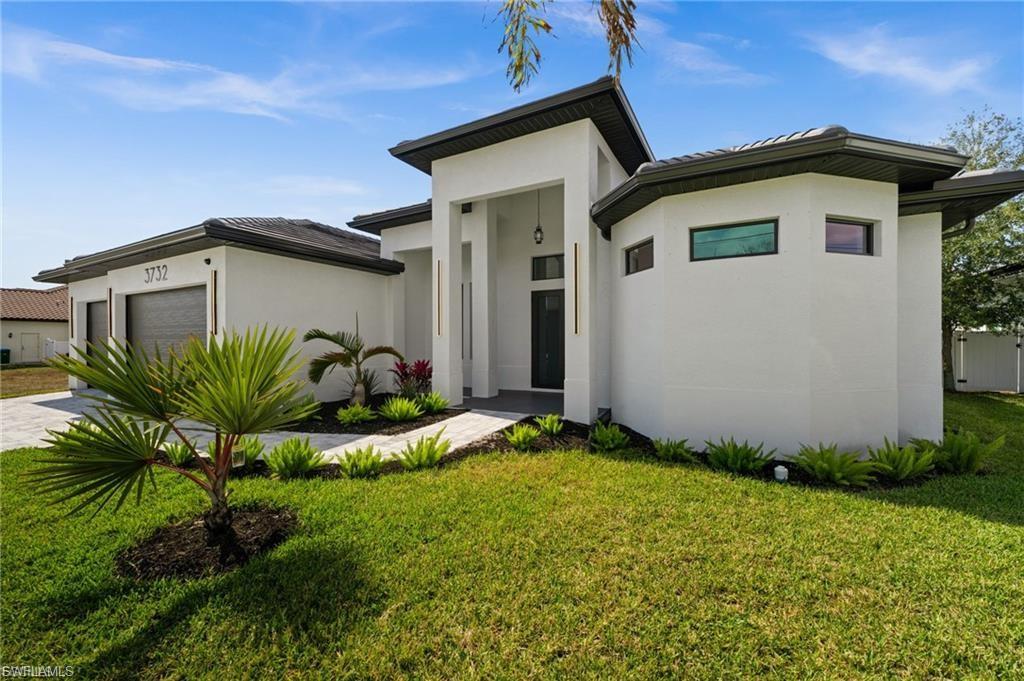 **2026 CUSTOM-BUILT GULF ACCESS POOL HOME | IMPACT WINDOWS & DOORS | 3-CAR GARAGE | NO HOA FEES!**

Experience modern Florida living in this newly constructed 2025 Gulf access home in Southwest Cape Coral! Offering 3 bedrooms, 3 full bathrooms, 2,213 square feet of living space, and a spacious 3-car garage on a 10,019-square-foot lot, this home combines contemporary architecture, upscale finishes, and exceptional indoor-outdoor entertaining spaces. Impact-resistant windows and doors provide an added layer of storm protection.

**INSIDE:** A grand double-door entrance opens to an impressive living area featuring dramatic coffered ceilings, a statement chandelier, polished marble-look porcelain tile, and designer wood and paneled accent walls. Oversized sliding glass doors connect the main living spaces to the screened pool area, creating an open and inviting atmosphere.

The kitchen features a waterfall-edge quartz island with seating for four, rich walnut-tone cabinetry, glass-front upper cabinets, designer pendant lighting, stainless steel appliances, a built-in double wall oven, cooktop, and beverage cooler.

The primary suite features direct pool access, a walk-in closet with custom built-ins, and a spa-inspired bathroom with a freestanding soaking tub, dual floating vanities, a crystal chandelier, and a frameless walk-in shower. Two additional bedrooms, two full bathrooms, and a separate front study provide flexibility for guests, work, or everyday living.

**OUTSIDE:** Enjoy Florida's outdoor lifestyle with a screened-in swimming pool, raised spa, and covered lanai featuring a full outdoor kitchen with built-in grill, linear fireplace, wood-accent ceiling, and ceiling fans. The generous pool deck provides space for lounging and entertaining. Impact-resistant windows and doors, an attached 3-car garage, and contemporary exterior finishes complete the home.

**LOCATION:** Located in desirable Southwest Cape Coral, this Gulf access property offers an opportunity to enjoy the Southwest Florida boating lifestyle alongside the comforts of newer construction. With no HOA fees listed, distinctive architectural details, and an outdoor entertaining area, this home delivers a combination of design, functionality, and location.

**SEE IT FOR YOURSELF!** Explore the virtual tour and youtube video before you schedule your private showing to experience this home's finishes, layout, and outdoor living spaces firsthand.