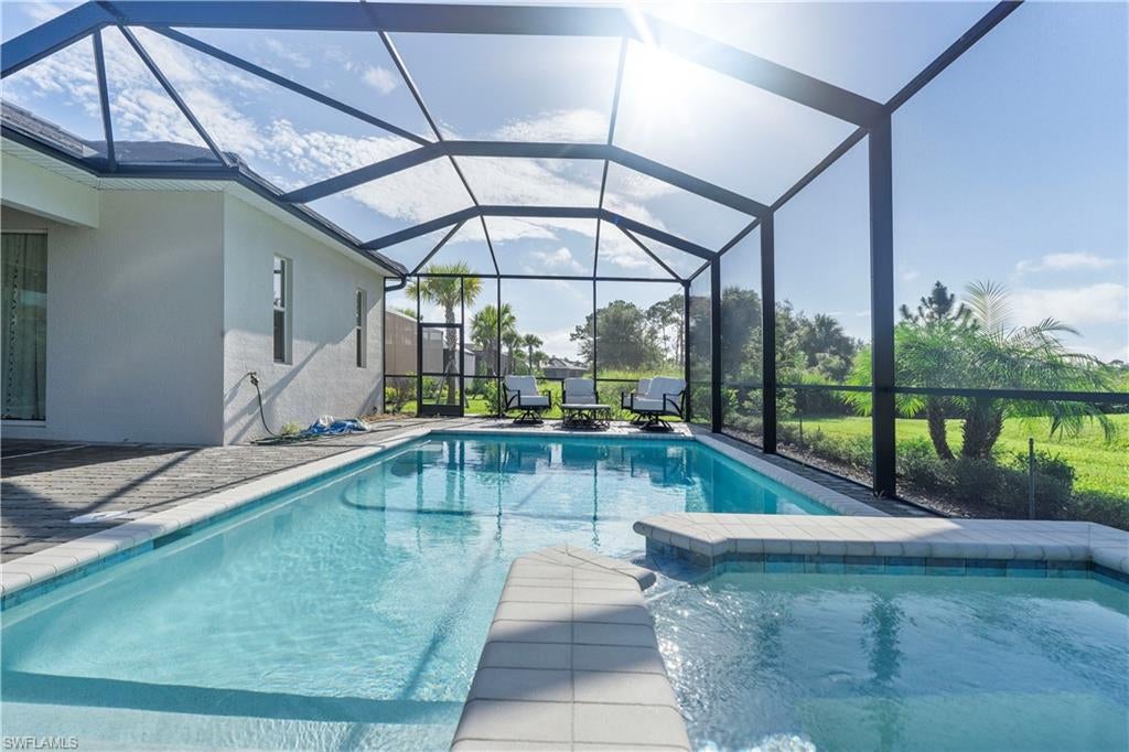 Golf Membership Included! Welcome to your Babcock National Beauty, where paradise and luxury living come together in this premier 5-star golf and country club community. The championship golf course, designed by the renowned Gordon Lewis, sets the stage for a lifestyle that is nothing short of extraordinary. This newer designer model pool home offers 2,247 square feet of living space with three well-appointed bedrooms, a dedicated office or den, and three elegant bathrooms. The state-of-the-art kitchen features stainless steel appliances, quartz countertops, and a large island, seamlessly flowing into the open dining and great room with a cozy gas fireplace and porcelain tile flooring. The lavish primary suite includes dual vanities, spacious walk-in closets, and private access to the expansive lanai, where you'll enjoy your heated pool, spa, and outdoor kitchen. The beautiful lot and 2 car garage. Every detail has been meticulously designed with high-end furnishings, luxurious linens, and top-quality mattresses to ensure your comfort. The home comes fully furnished, complete with large smart TVs and high-speed Wifi included. Step outside and embrace resort-style living with unlimited golf access for a nominal cart fee, along with four pools, a hot tub, spa, sauna, tiki bar, fitness center, tennis and pickleball courts, gorgeous club house with the Enclave Restaurant and Bar for fine dining, brunch and events. Beyond the gates, Babcock Ranch offers a lively atmosphere filled with nightly activities, food trucks, live bands, and restaurants, miles of hiking and biking trails, all set in a golf-cart-friendly community. Centrally located to Fort Myers, Naples, and Cape Coral, this home blends the comforts of modern living with endless amenities. Pet-friendly with approval, this residence is available for a short term seasonal rental at $10,000 per month or with an annual lease at $5,500 per month. Available October of 2026 to October 2027. This is not just a home—it's the lifestyle you've been waiting for.