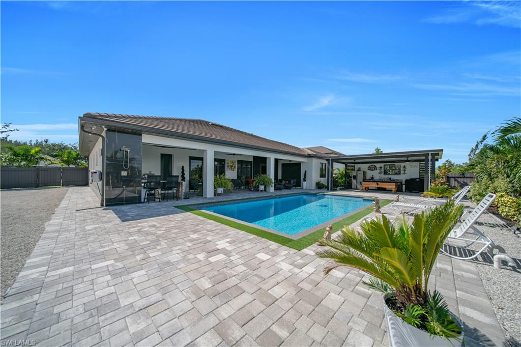 Welcome to this stunning, modern, and spacious 2023-built home in Cape Coral, situated on an impressive 0.38-acre oversized lot. Offering approximately 2,361 sq. ft. of living area and 3,726 sq. ft. under roof, this property combines contemporary design, generous living spaces, exceptional indoor-outdoor living, and a truly unique outdoor setting.
The high-ceiling modern interior features an open-concept layout, a beautiful contemporary kitchen with abundant cabinetry and a large island, stylish finishes throughout, 4 bedrooms ,3 bath, ceiling fans, and plenty of natural light. The spacious primary suite offers a luxurious retreat with a dual-vanity bathroom and separated vanity areas, providing both functionality and privacy.
Enjoy the Florida lifestyle outdoors with a private pool, outdoor shower, and expansive paved entertaining area—perfect for relaxing, entertaining, and enjoying the beautiful surroundings. The property is completely fenced, offering added privacy and security.
The oversized lot is beautifully enhanced with numerous fruit trees, herbs, and spices, all organically grown and thoughtfully planted throughout the property. This lush garden setting adds charm and character while offering the opportunity to enjoy fresh, homegrown produce right from your own backyard.
Parking is exceptional, with a 3-car garage plus a detached multi-vehicle carport, offering plenty of space for vehicles, recreational toys, guests, or additional storage.
Location is another major highlight. The property is conveniently located near Cape Coral’s highly anticipated Seven Islands development, an exciting waterfront project expected to bring additional dining, entertainment, and recreational opportunities to the area. A major supermarket development has also been approved nearby by the City of Cape Coral, adding even more convenience and future growth to the surrounding neighborhood.
The home also offers excellent connectivity through Pine Island Road, one of the area’s main corridors, providing convenient access toward US-41 and I-75, as well as an easy route west toward Matlacha and Pine Island. This strategic location makes commuting, shopping, dining, boating, and enjoying Southwest Florida’s coastal lifestyle especially convenient.
With continued development in the surrounding area, this location offers strong future potential and may benefit from continued property value appreciation.
A rare opportunity to own a spacious, modern home with a private pool, organic fruit and herb garden, exceptional parking, an oversized lot, and a prime location near some of Cape Coral’s most exciting future developments.