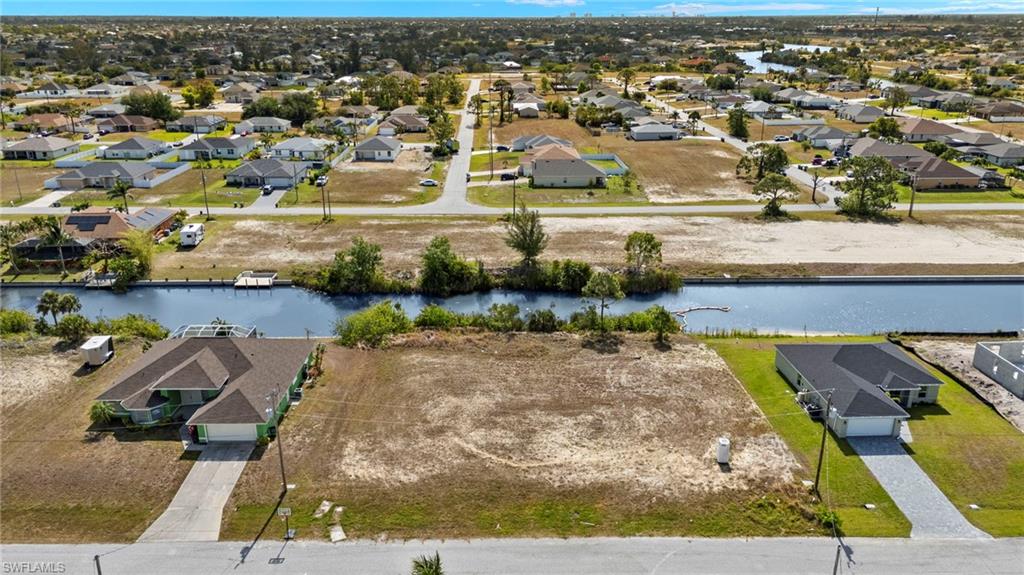 Experience the ultimate in waterfront living with this stunning lot in NW Cape Coral! Imagine building your dream home in a serene setting, surrounded by the beauty of Florida's lush landscapes and vibrant sunsets. Don't miss out on your chance to invest in your piece of paradise!
