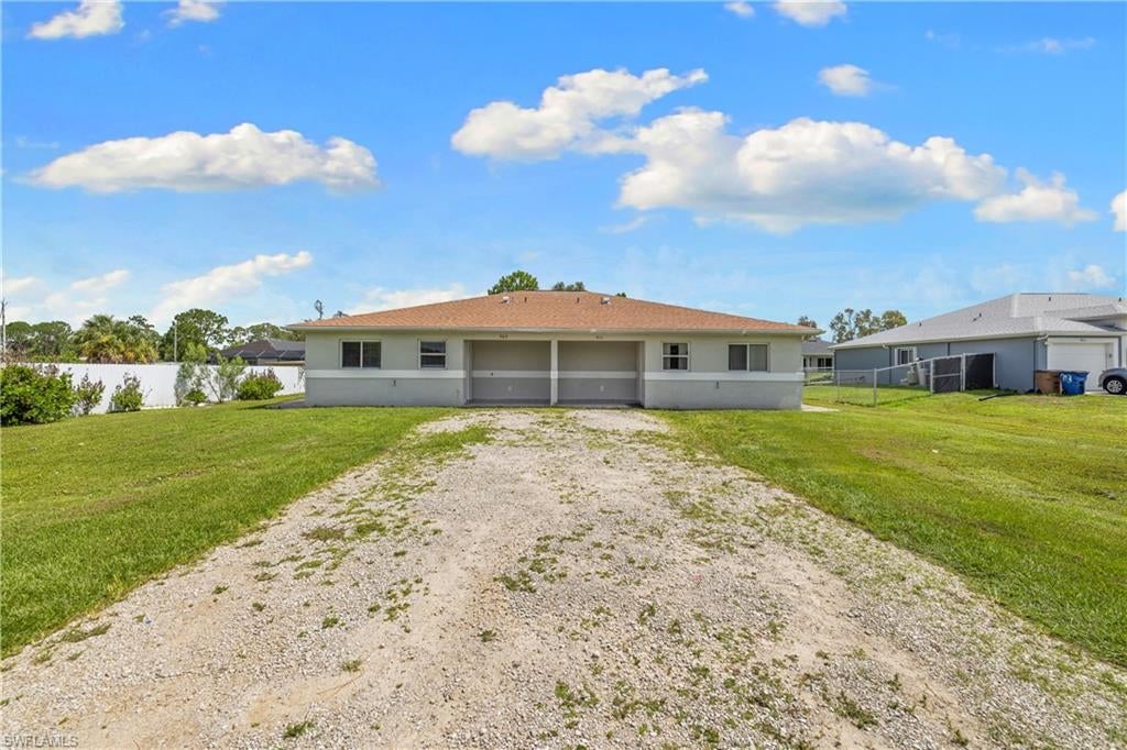 INVESTMENT OPPORTUNITY IN LEHIGH ACRES! Welcome to 909/911 Jaguar Blvd, a well-maintained duplex offering an excellent opportunity for investors, owner-occupants, or buyers looking to generate rental income. Built in 2006, this spacious property features two separate units with a total of 6 bedrooms and 4 bathrooms and approximately 2,166 square feet of living space.