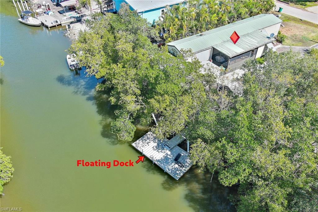 Exceptional waterfront opportunity on Plantation Island offering direct access to the Ten Thousand Islands and Gulf waters.

This well-maintained 3-bedroom, 2-bath residence is thoughtfully equipped for boating, fishing, and relaxed coastal living. The property delivers the functional improvements serious waterfront buyers value most.

The aluminum floating dock, constructed with stainless steel hardware, provides water and electric service at the slip. A covered, screened fish-cleaning station with lighting enhances usability for avid anglers. The mangrove-lined canal offers privacy and quick access to world-class backwater and offshore fishing.

Exterior improvements include:

• Detached aluminum carport suitable for boat and vehicle storage (or two vehicles)
• Spacious concrete driveway with ample parking
• Connected tool/workshop room with built-in bench space
• Additional outdoor storage shed
• Expansive screened lanai with excellent lighting and airflow
• Enclosed side utility room off the lanai with refrigerator for added convenience
• Storm shutters surrounding the residence
• Aluminum awnings for sun and weather protection

Interior features include:

• Updated Vinyl plank flooring throughout
• Updated drywall and trim
• Updated Soft-close hardwood cabinetry
• Updated Formica countertops
• Renovated primary bathroom featuring a large tiled walk-in shower
• Guest bath with tub/shower combination
• Walk-in closet in primary suite
• Interior laundry/storage space

A metal roof approximately seven years old provides durability and peace of mind.

Future Potential:
Per the owner of the adjacent vacant parcel, purchase of the neighboring lot may be an option, creating expanded development flexibility. Recent code updates now allow construction of single-family homes on Plantation Island (buyer to verify zoning and use). A grant has also been approved for municipal sewer expansion to Plantation Island, offering long-term infrastructure enhancement for the community (buyer to verify timeline and availability).

Whether utilized as a primary residence, seasonal retreat, redevelopment opportunity, or dedicated fishing getaway, this property offers both immediate waterfront enjoyment and long-term potential.

Bring your boat — and bring your vision.