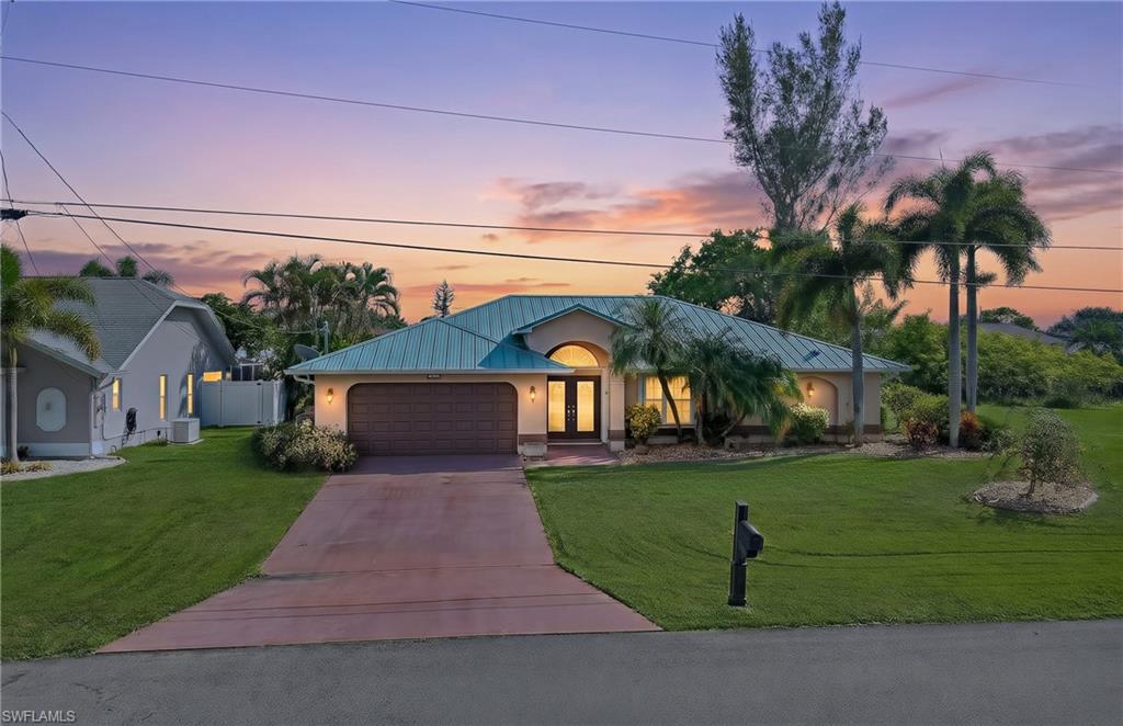Waterfront with a dock and a pool in Southeast Cape Coral. This 3-bedroom, 2-bath home sits on 80 feet of freshwater canal with a concrete seawall and concrete dock, ready for fishing and kayaking right from your backyard.

The big-ticket items are done: 2018 metal roof, 2021 A/C, and a newer water heater, plus accordion storm shutters, concrete block construction, and Flood Zone X. No HOA. The home faces south, so the pool and lanai get sun all day.

Inside, 1,987 square feet on one level with vaulted ceilings and a split-bedroom plan. The living and dining rooms open through sliders to the lanai. The granite and white-cabinet kitchen has a breakfast bar and looks over a second living area and breakfast nook, both with sliders to the pool. The primary suite has a walk-in closet and its own pool access. The two guest bedrooms have wood floors and share a bath that doubles as the pool bath. Tile runs through the main living areas, skylights add natural light, and the laundry room includes a utility sink, cabinets, and the washer and dryer.

Outside, the covered lanai has space for dining and lounging, and the screened pool deck overlooks the yard and canal. An outdoor shower, irrigation system, and 2-car garage round it out. City water and sewer.

Sold as-is and priced for the buyer who wants to pick their own finishes with the major systems already handled. Publix, Target, and Lowe's are about a mile away, and Veterans Parkway is close by for Fort Myers, RSW, and the Gulf beaches.