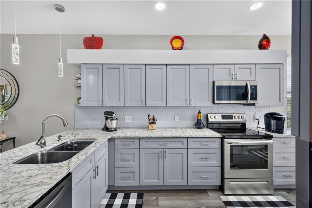 PRICE REDUCTION! Now offered at $344,900

Only remodeled corner unit currently available in the entire Heritage Cove community! This sun-filled, lake-view unit sits in a gated 55+ community just off scenic McGregor Blvd, minutes from Sanibel and Fort Myers Beach. This rarely available 1300 sqft, 2-bedroom plus den, 2-bath third-floor unit has been beautifully updated and furnished for an easy move in.

Being a corner unit, natural light pours in through extra windows, and brand-new flooring runs throughout the entire home alongside a freshly remodeled kitchen with stainless steel appliances, a breakfast bar, and generous cabinetry. Step out to your private, screened lanai overlooking the lake, an ideal spot for morning coffee or sunset unwinding.

The open living area flows into a versatile den that works well as a home office, media room, or reading nook. The primary suite offers two walk-in closets and an updated ensuite bath with a walk-in shower. A split floor plan gives guests privacy in the second bedroom, which also has its own walk-in closet and full bath. In-unit laundry with a full-size washer and dryer adds everyday convenience.

You'll also find covered parking, a private storage closet for beach and sporting gear, and a screened front entry that welcomes the Gulf breeze. The building's roof was replaced just 3 years ago, and the HOA covers cable, Wi-Fi, water, lawn care, and more. Residents enjoy resort-style amenities including a pool, clubhouse, fitness center, bocce, and clay tennis courts, all set among mature trees and sidewalks throughout the community.

Whether you're a full-time resident or seasonal snowbird, this is one of the best units in Heritage Cove: corner unit, lake view, fully furnished, and move-in ready.