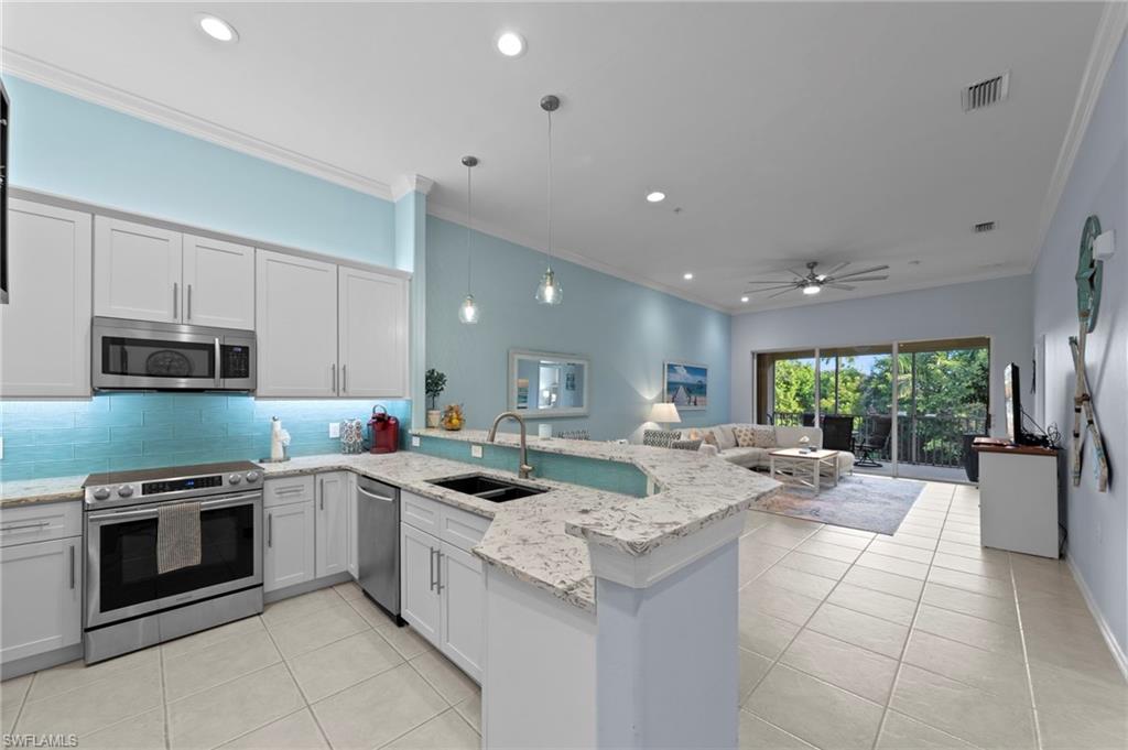 DISCOVER THE PERFECT COMBINATION OF STYLE, COMFORT, AND RESORT-STYLE LIVING IN STERLING OAKS! This beautifully RENOVATED, FULLY FURNISHED & TURNKEY coach home offers 2 bedrooms plus a den, 2 completely updated bathrooms, and a private garage, all within one of North Naples' most desirable gated communities. With extensive improvements throughout, including a NEW A/C (June 2026), this residence is truly move-in ready and designed for effortless Florida living.

From the moment you enter, you'll appreciate the bright, open feel, tasteful finishes, and thoughtfully selected furnishings that make this home both inviting and functional. The beautifully remodeled kitchen features quartz countertops, a decorative tile backsplash, extended white cabinetry, stainless steel appliances, a newer refrigerator (2024), and a spacious pantry. Whether entertaining guests or enjoying a quiet evening at home, the kitchen flows effortlessly into the comfortable living and dining areas. Neutral tile flooring throughout the main living spaces adds to the home's clean, cohesive appearance.

The generously sized primary suite offers a welcoming place to unwind, complete with a stunningly renovated bathroom featuring dual vanities, quartz countertops, and beautiful finishes. The second bathroom has also been fully remodeled, while the additional bedroom and versatile den provide flexibility for visiting family, a home office, or extra living space. Step outside to the private screened lanai and enjoy tranquil views of the surrounding landscaping, creating an inviting extension of the indoor living space.

Living in Sterling Oaks means enjoying far more than just a beautiful home. Residents have access to an outstanding selection of amenities, including a resort-style pool overlooking the lake, comfortable poolside chaise lounges, multiple tennis courts with league play, pickleball courts, basketball and bocce courts, a well-equipped fitness center, children's play area, and an on-site restaurant offering fine dining. The community's beautifully maintained grounds and welcoming atmosphere make it easy to embrace an active and social Southwest Florida lifestyle.

AN EXCEPTIONAL NORTH NAPLES LOCATION! Just minutes from Barefoot Beach, Wiggins Pass Beach, premier shopping, and an abundance of dining and entertainment options, Sterling Oaks offers the convenience of having everything you love about Naples close to home.

RENOVATED, TURNKEY, AND READY TO ENJOY! Whether you're searching for a full-time residence or a seasonal escape, this beautifully appointed coach home offers the opportunity to move right in without the hassle of renovations or furnishing. Enjoy the convenience, amenities, and lifestyle that make Sterling Oaks such a special place to call home!