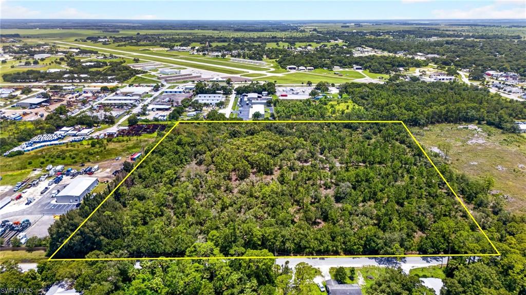 16+ ACRES OF PRIME INDUSTRIAL LAND — TWO ADJOINING PARCELS, ONE RARE OPPORTUNITY! Large contiguous acreage in City of LaBelle with 840+/- FT frontage on paved E. Lincoln Ave. Near SR 29, four-laned SR 80, downtown & LaBelle Airport. Front portion zoned LIGHT INDUSTRIAL, rear two-thirds zoned HEAVY INDUSTRIAL. Uplands and wetlands approximately half and half, with wetlands located primarily in the southeast rear of property. WETLAND STUDY AVAILABLE. CITY WATER & SEWER is available in area and subject to line proximity. Surrounded by other large industrial tracts. Build one major facility, split into multiple sites, or develop several buildings on the combined acreage.
