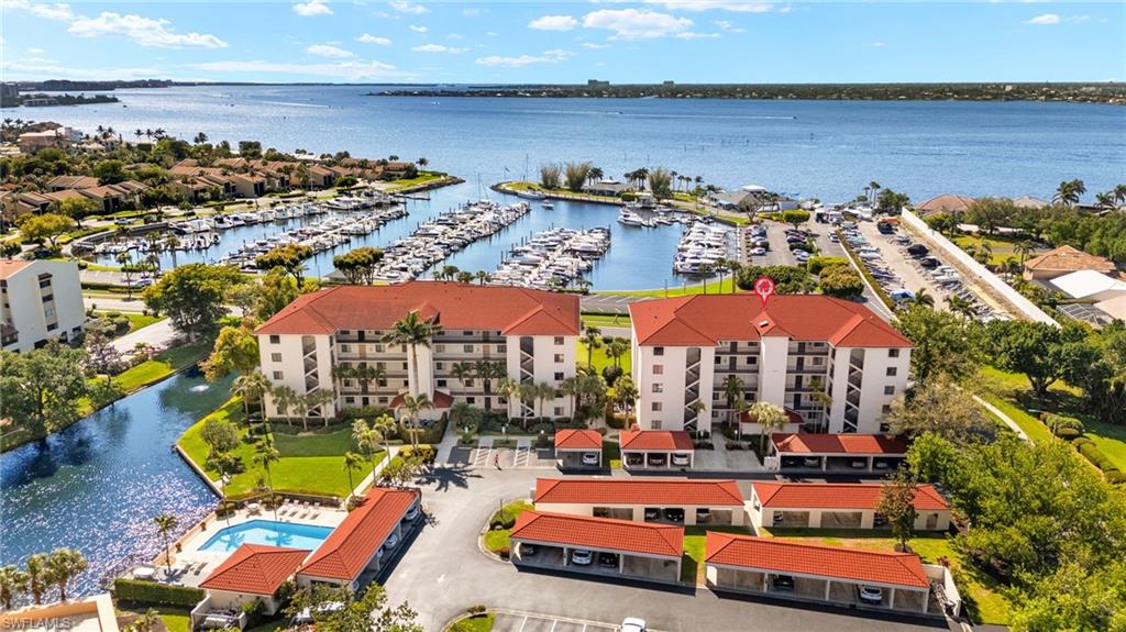 Step into luxury and enjoy breathtaking views of the marina and spectacular sunsets over the Caloosahatchee River.  This Sunset Harbor condo features two bedrooms, two baths, with a den/third bedroom option. This TURN-KEY residence with a spacious open floorplan offers a beautiful kitchen with white Shaker cabinets and stainless steel appliances. This pet friendly property includes newer air conditioner, electric hurricane shutters, an extra storage unit, and covered parking. Sunset Harbor enjoys one of the lowest HOA fees in The Landings.

The Landings Yacht, Golf, and Tennis Club is one of the most prestigious communities off of McGregor. Enter through the 24 hour guarded gates into the lush park-like grounds. Amenities for all residents include: A boat slip in the FULL SERVICE marina up to 60' (if available), UNLIMITED golf, tennis, pickleball, bocce ball, fitness center, numerous clubs and activities. The Landings has TWO on-site restaurants, including the newly-remodeled Wheelhouse on the river.