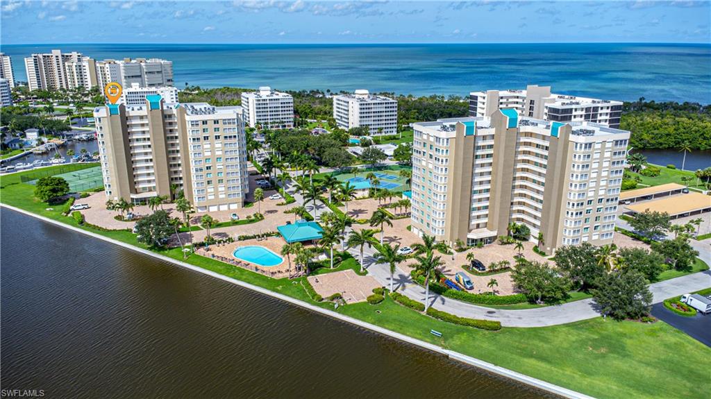 One of the newest and most sought after buildings on the Vanderbilt Beach Peninsula. Gulf Breeze is located in a gated community in a secure building, offering waterfront condos on the bay with views of the Gulf of Mexico. Light and bright unit is turnkey right down to the beach chairs and an umbrella. Jult bring your bathing suit, flip flops and toothbrush. Secondary bedrooms have queen size beds and the master is a king. This unit has been remodeled and includes new furniture and linens, granite and s/s appliances. Enjoy year round sunset views from your screened in lanai. Just a short walk to Delnor Wiggins and Vanderbilt Beach. Walk for miles on the soft, pure white sand that edges the turquoise waters of the Gulf of Mexico, hunt for sea shells, watch shore birds and take a dip in the Gulf. Gulf Breeze has an active social agenda. Tennis and pickleball courts, heated swimming pool, bocce court, car wash and large parking lot for your guests. The Shops at Mercato are a mile away and include, shopping, dining, nightlife, Whole Foods. Waterside shops are 3 miles away and Olde Naples approximately 9 miles.