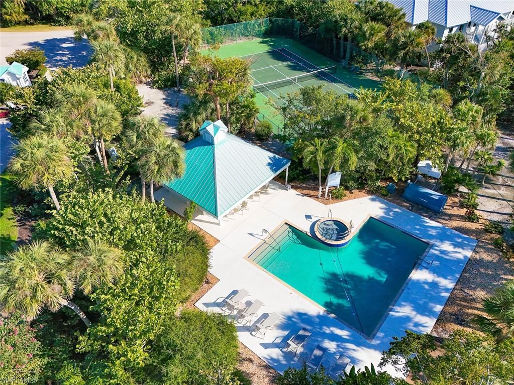 Incredible Value! Such a deal for someone wanting to live their island dream! This property was purchased for 280K 5 years ago, the Sellers are very motivated! Design your dream home from the ground up with every detail, just how you imagined it. But the real magic?? Morning laps just steps away in the sparkling community pool (hello, low-impact cardio and instant refresh). Afternoon rallies on the tennis courts (your built-in stress relief + social time). Evening strolls to your private community beach access (no crowds, no parking stress, just sand, serenity, and sunset skies). Now you find out that you can start this dream...at a dream price!
