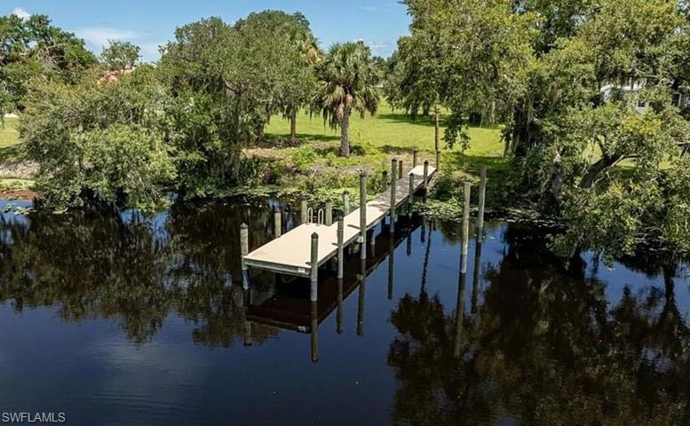 Situated on nearly one acre (0.91 acres) in one of Southwest Floridas most coveted waterfront
communities, the property enjoys a truly exceptional setting within a quiet oxbow of the
Caloosahatchee River. The unique location provides calm, protected waters, remarkably little
boat traffic, and uninterrupted views of a lush, tree covered island that creates a sense of
privacy and natural beauty seldom found along Floridas waterways.
A private 47 foot dock extends into the river, offering immediate access to boating, kayaking,
paddleboarding, and fishing, or simply providing the perfect place to relax with a morning
coffee while watching eagles, ospreys, herons, and other native
wildlife that frequent the shoreline.
Located within the prestigious River Wind Cove community on scenic North River Drive, this
exceptional property is surrounded by magnificent mature oak trees, expansive homesites, and
architecturally distinctive custom residences. The neighborhood is known for its quiet elegance,
natural beauty, and welcoming atmosphere, making it one of the areas most desirable places
to call home.
While the setting feels like a private waterfront sanctuary, everyday conveniences are only
minutes away. Within approximately 15 minutes you will find Publix, shopping, medical
facilities, and an excellent selection of restaurants, including a favorite waterfront Tiki
restaurant where you can arrive by car or by boat. Downtown Fort Myers is less than 30
minutes away, and a major highway providing convenient access throughout Florida is only 15
minutes from the property.
Properties that combine this level of privacy, natural beauty, navigable waterfront, and
convenient location are becoming increasingly rare. Whether you envision peaceful mornings
on the dock, afternoons exploring Southwest Florida's waterways, or evenings entertaining
family and friends beneath towering oak trees, this remarkable riverfront estate offers an
exceptional opportunity to embrace the finest in Florida waterfront living.
This is more than a location for your home, it is a place to slow down, reconnect with nature,
and enjoy a lifestyle that many dream about but few ever experience.
--------------------------------------------------------------------------------------------------------------------------