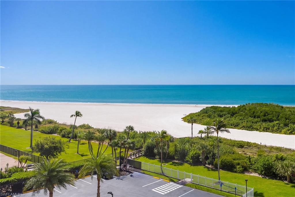 Breathtaking beachfront views! Coastal living at its best.  Gated community in prestigious Southseas Towers.  2 bed/2 bath condo with SW exposure for ample light. Beach views from living room, primary bedroom, dining room, kitchen & balcony. Contemporary renovation (2021). White Shaker cabinets with granite tops (kitchen & bathrooms). Stainless steel appliances. Engineered wood plank floors throughout. Impact windows & doors. Only Tower 3 & 4 allow weekly rentals, which is why their rental history has reached as high as $63k/year). Heated resort pool overlooking the Gulf with beach access. Covered garage parking. Fitness center, tennis/pickleball courts & optional boat slip rental available. Marco Island is famous for its white sandy beaches, boating, water sports, and wide sidewalks all over the island, great for walking & bicycling. Walking distance to restaurants, entertainment, shops, ice cream and grocery store. Own your piece of paradise today!