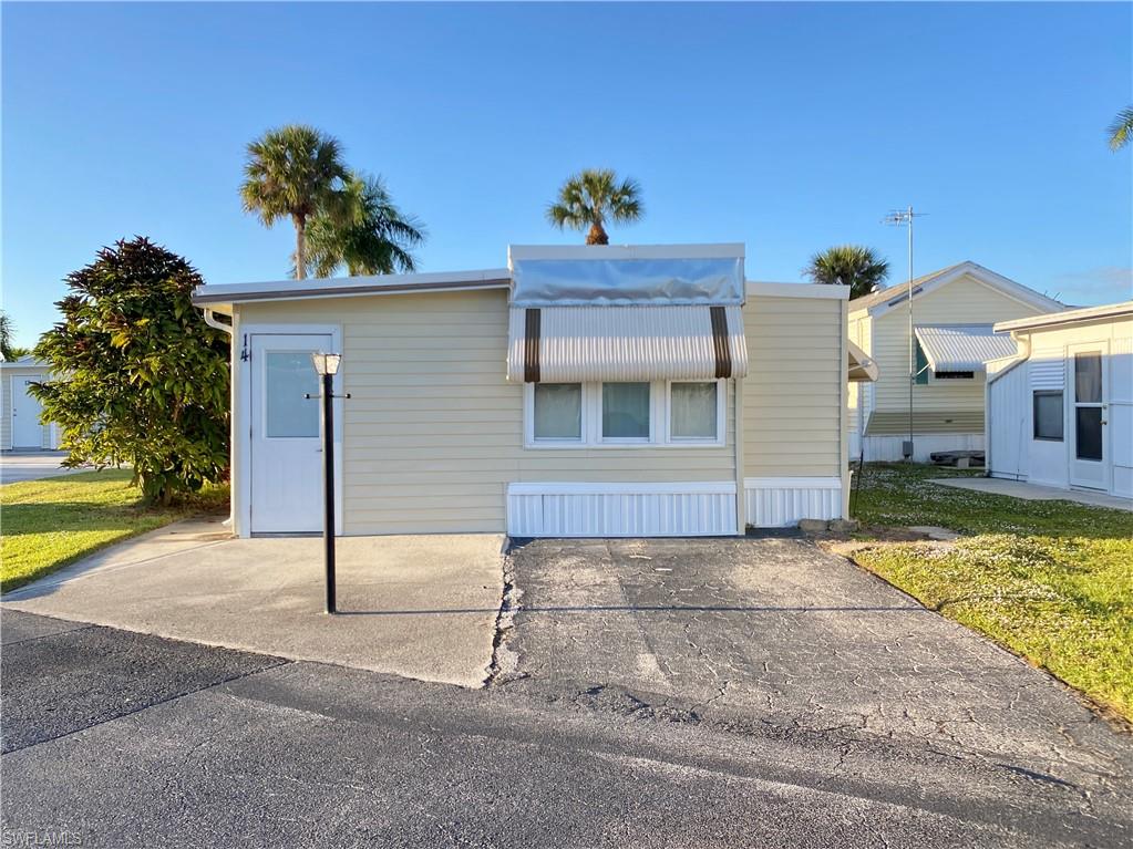 Affordable Florida living in Enchanting Shores, a 55+ boating community in South Naples! This 1-bedroom, 2-bath home offers an easy-to-enjoy layout with a Florida room that adds flexible living space and includes its own full bath and laundry. Recent improvements include a new AC in 2023 and new ductwork in 2024. Inside, you'll find wood-style flooring, white kitchen cabinetry, and a comfortable living area ready for your personal touches.   

Enjoy an active Florida lifestyle with a heated community pool, clubhouse, social room, tennis, pickleball, shuffleboard, bocce, billiards, hobby room, library and more. Boaters will appreciate the community boat ramp and indirect Gulf access through Henderson Creek.   

Whether you're looking for a seasonal escape, a year-round home, or an affordable way to enjoy the Naples and Marco Island area, this is an opportunity to own in a boating community without the price tag of many Southwest Florida communities. Conveniently located near beaches, shopping, dining and everyday necessities.