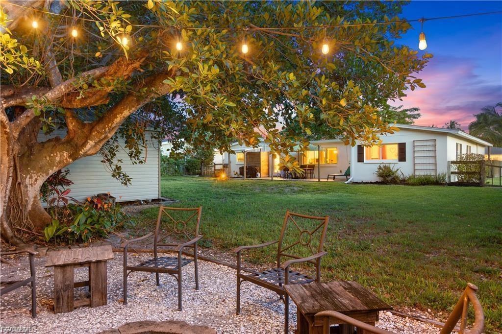 Welcome to 509 Val Mar Drive! | Tucked just off historic McGregor Blvd and steps from the Caloosahatchee River, this one-of-a-kind Mid-Century Modern gem blends timeless style with smart upgrades and cozy charm. From the moment you arrive, you'll notice the attention to detail—from mature landscaping and smart outdoor lighting to a unique open-air front courtyard featuring custom Bahama shutters, and wood columns. Inside, natural light floods through impact-rated dual-pane windows, illuminating open, airy living spaces with crown molding, board and batten walls, shiplap accents, and custom millwork throughout. The heart of the home is a thoughtfully upgraded kitchen featuring custom cabinetry with under-cabinet lighting, a farmhouse sink, new appliances, and built-in storage. An oversized dining area with charming built-ins offers room to host family gatherings or intimate dinners. The living spaces and bedrooms feel bright and breezy, anchored by terrazzo tile floors and complemented by barn doors and stylish ceiling fans. The primary suite boasts a custom walk-through closet, while additional highlights include dual-zone A/C, two hot water heaters (including tankless), a spacious laundry and storage room, and a garage with two industrial overhead fans—perfect for a workshop. Outside, the fully fenced backyard is your personal retreat, complete with a fire pit area with overhead lighting, a covered grilling patio, and a custom 2023-built shed ideal for a man cave, she-shed, or hobby space. Practical upgrades include a new metal roof (2020), a 13,000-watt whole-house generator (negotiable) with RV-style hookup, a smart irrigation system, and a reverse osmosis water treatment system. You'll also enjoy plenty of parking, a separate oversized storage room in the garage, and no HOA or deed restrictions. Set in peaceful Val-Mar Village—loved for its community vibe, walkability to the river, proximity to shopping, and quick access to Downtown Fort Myers, Cape Coral, and the beaches (Fort Myers, Sanibel, Captiva) —this is more than just a home. It’s a lifestyle. Don’t miss your chance to experience this rare blend of character, comfort, and convenience. Schedule your private tour today.