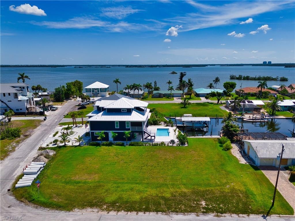 Welcome to your dream oasis in Fort Myers Beach, where paradise awaits with deeded beach access and direct Gulf access! This stunning property is just shy of 1/3 acre of prime land, perfect for building your dream home with space for a pool and garages. Embrace the outdoors with easy access to Estero Bay and breathtaking views of beautiful homes that surround you. Enjoy a lifestyle of convenience, just minutes from dining and entertainment venues and a short ride to huge outlet malls, sporting events and many concerts and art show events. Plus, the famous Margaritaville is just down the street! For boating enthusiasts, a quick boat ride gets you to the Gulf of Mexico for some of the best boating and fishing in Southwest Florida. Your coastal dream home is ready to become a reality in this sought-after beachside neighborhood. What are you waiting for? We only have turtle trails in soft white sand... no snow mobile trails or snowblowers.