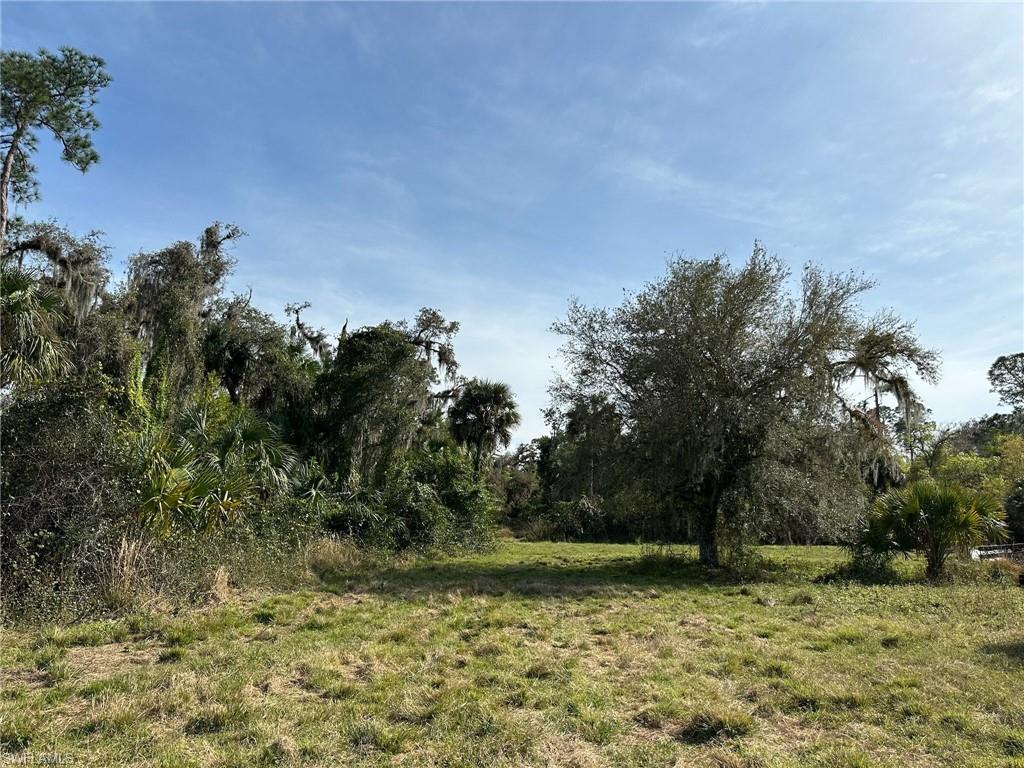 82.214 +/- acre country escape in the charming Muse community. Located on a well-maintained dirt road approximately 1 1/2 miles off of Loblolly Bay, this is ideal for someone seeking peace and privacy while maintaining modern conveniences (Amazon delivers here!). Zoned Ag-2, which allows residential use in addition to agriculture. Bordered by Bee Branch on the east side of the property and teeming with grandfather oaks, cypress knees, and native vegetation on approximately 30 acres, with about 50 acres of cleared land along the road. There's a large equipment barn and well for irrigation towards the rear. Lots of game and wildlife in this area, perfect for camping, hunting, or building a country retreat. Pictures truly don't do it justice! Approximately 15 minutes from shopping, restaurants, and schools in LaBelle, 45 minutes from both I-75 and Babcock Ranch, under an hour from Southwest Florida International Airport, and 2 1/2 hours from Miami.