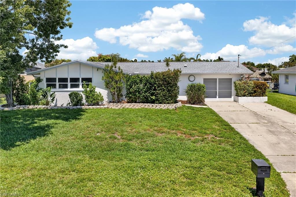 WATERFRONT POOL HOME IN THE HEART OF CAPE CORAL! Welcome to this beautifully maintained 3 BEDROOM, 2 BATHROOM HOME offering the perfect blend of comfort, style, and the ultimate Florida boating lifestyle. Situated on 80 FEET OF WATERFRONT, this exceptional property features a CONCRETE DOCK AND SEAWALL WITH BOTH WATER AND ELECTRIC, making it easy to keep your boat ready for your next adventure. With a SHORT BOAT RIDE TO OPEN WATER, you'll enjoy convenient access to world-class boating, fishing, and waterfront dining.

Step inside to discover a bright and inviting floor plan featuring LUXURY VINYL PLANK FLOORING THROUGHOUT THE MAIN LIVING AREAS AND BEDROOMS, creating a seamless and modern look. The beautifully updated kitchen serves as the heart of the home and features GRANITE COUNTERTOPS, STAINLESS STEEL APPLIANCES, ample cabinetry, and a functional layout designed for both everyday living and entertaining.

The spacious primary suite offers a relaxing retreat complete with a WALK-IN CLOSET and DIRECT ACCESS TO THE POOL AREA, allowing you to enjoy the Florida lifestyle from the moment you wake up. The updated guest bathroom adds a fresh, modern touch for family and visitors alike.

One of the home's standout features is its seamless indoor-outdoor living. DOUBLE POCKET SLIDERS open the living area to the screened lanai, creating an expansive entertaining space perfect for gatherings or simply enjoying the beautiful waterfront views. The SCREENED POOL is equipped with a HEAT PUMP, allowing for comfortable swimming throughout much of the year.

Outside, you'll appreciate the MATURE, WELL-MAINTAINED LANDSCAPING that enhances the home's curb appeal while creating a lush tropical setting. Whether relaxing by the pool, enjoying the water views, or heading out on the boat, this property truly embodies the Southwest Florida lifestyle.

Additional peace of mind comes from a NEW A/C SYSTEM INSTALLED IN 2025, and NEW ROOF IN 2021, providing comfort and efficiency for years to come.

Conveniently located near shopping, dining, entertainment, golf courses, and Cape Coral's many parks and marinas, this move-in-ready waterfront home offers everything you've been searching for.

DON'T MISS YOUR OPPORTUNITY TO OWN THIS BEAUTIFULLY UPDATED GULF-ACCESS POOL HOME WITH 80 FEET OF WATERFRONT AND A SHORT BOAT RIDE TO OPEN WATER!