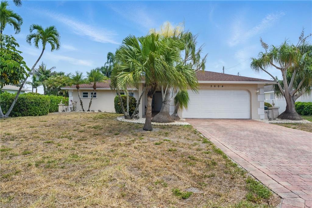 This Sudbury Estates offering is a chance to live the quiet Bonita Springs beach lifestyle.  The peaceful backyard allows the owner to beat the heat in the salt water pool with a screened-in lanai.  Lush landscaped palms act as a privacy fence.  An open floor plan admits ample natural light through new impact windows and sliding glass door installations.  Most importantly, this property has remained safe from flooding during the recent hurricane activity and is still bike-able to the beaches!  The roof was completely replaced in 2022.