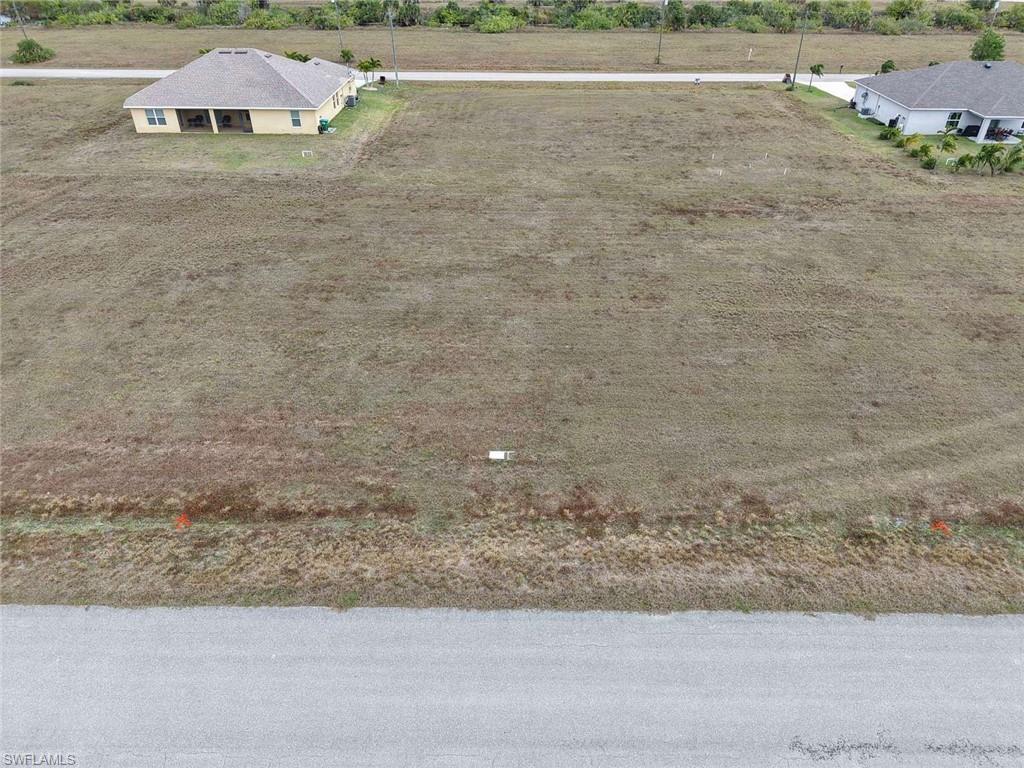 OWNER FINANCING AVAILABLE Discover this 0.24-acre parcel in Cape Coral, located in Lee County. Zoned R1 (Single-Family Residential), this property is ideal for building a primary residence, vacation home, or investment property in one of Southwest Florida’s fastest-growing areas. The lot features flat terrain, making it perfect for easy and cost-effective development. With paved road access, you’ll enjoy convenient, year-round entry an important benefit for both construction and everyday living. Cape Coral is known for its extensive canal system, boating lifestyle, and proximity to Gulf Coast attractions. The property is located near Matlacha Pass Aquatic Preserve, offering kayaking, fishing, and access to beautiful coastal waters, along with nearby shopping, dining, and entertainment. With no HOA restrictions, residential zoning, and city utilities available, this 0.24-acre parcel presents an excellent opportunity to build, invest, or secure land in a thriving Florida market.