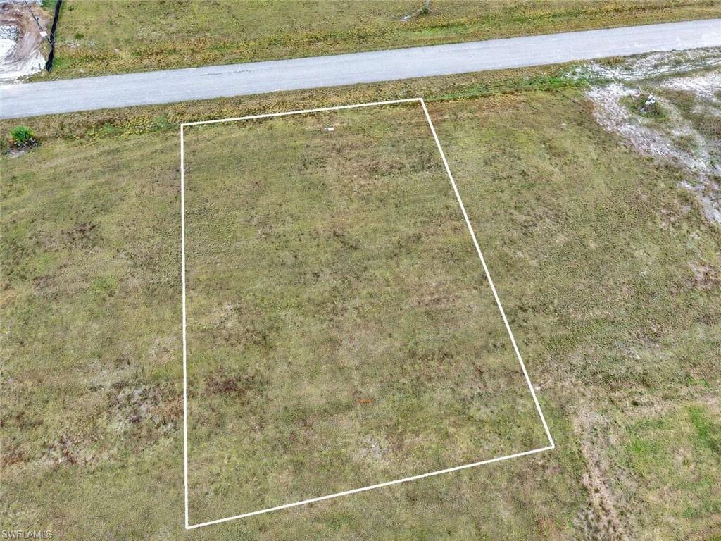 OWNER FINANCING AVAILABLE Discover this 0.24-acre parcel in Cape Coral, located in Lee County. Zoned R1 (Single-Family Residential), this property is ideal for building a primary residence, vacation home, or investment property in one of Southwest Florida’s fastest-growing areas. The lot features flat terrain, making it perfect for easy and cost-effective development. With paved road access, you’ll enjoy convenient, year-round entry an important benefit for both construction and everyday living. Cape Coral is known for its extensive canal system, boating lifestyle, and proximity to Gulf Coast attractions. The property is located near Matlacha Pass Aquatic Preserve, offering kayaking, fishing, and access to beautiful coastal waters, along with nearby shopping, dining, and entertainment. With no HOA restrictions, residential zoning, and city utilities available, this 0.24-acre parcel presents an excellent opportunity to build, invest, or secure land in a thriving Florida market.
