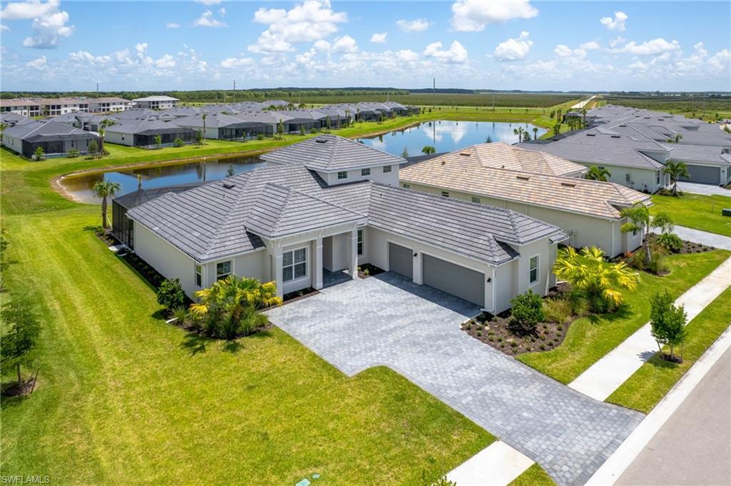 BUNDLED GOLF MEMBERSHIP INCLUDED – PRIVATE GOLF LIVING AT ITS FINEST!

Welcome to your dream golf retreat in paradise! Offered TURNKEY FURNISHED and move-in ready, this home makes it effortless, simply bring your suitcase and start living the Florida dream. This highly sought-after and rarely available Napoli Grande II model is located within The National Golf & Country Club, now an exclusive golf course community, offering an unparalleled lifestyle for golf enthusiasts and luxury homebuyers alike.

Perfectly situated on a premium oversized corner lot just steps from the newly completed resort-style amenities, this exceptional home combines elegance, comfort, and convenience. Inside, you'll find an open and spacious floor plan featuring 4 bedrooms + loft, beautiful tile flooring throughout the living areas, formal dining, a breakfast nook, and a stunning kitchen complete with quartz countertops and double wall convection ovens.

Step outside and enjoy your own private Florida oasis with a heated saltwater pool and spa, perfect for entertaining or unwinding after a day on the course.

Upstairs, the expansive bonus loft offers endless possibilities with a kitchenette/wet bar, full bathroom, and oversized living space—ideal as a guest suite, media room, game room, or additional bedroom.

Best of all, your Bundled Golf Membership is INCLUDED, providing immediate access to championship golf and the incredible private club lifestyle. Residents enjoy world-class amenities including a resort-style pool, tennis, pickleball, full-service spa, fitness center, tiki bar, and on-site dining.

This is a rare opportunity to own one of the community's most desirable floor plans while enjoying everything that golf club living has to offer. Luxury, golf, and resort-style living come together perfectly in this exceptional home.